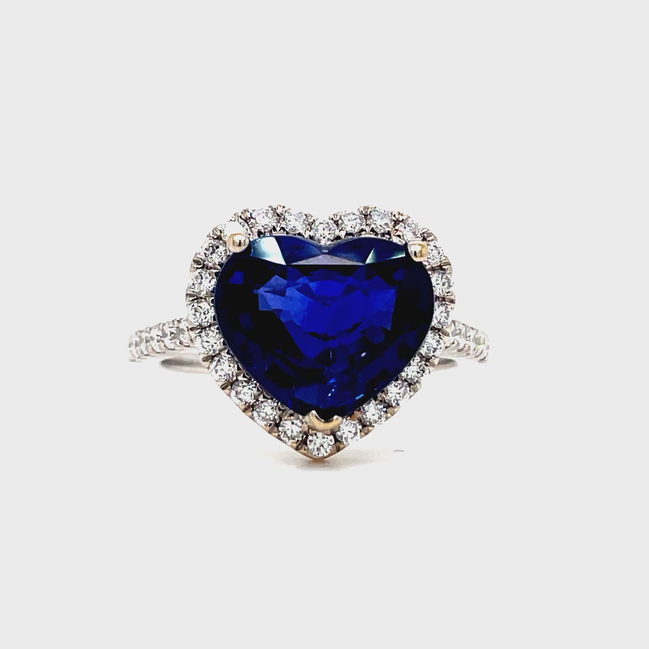 ndulge in the ultimate expression of love with our Heart Shape Sapphire and Diamond Ring. Crafted from 18k white gold, the centerpiece is a stunning 4.14 carat heart-shaped sapphire, surrounded by 0.42 carats of brilliant round diamonds. This unparalleled piece exudes elegance and luxury, making it a timeless addition to any jewelry collection.