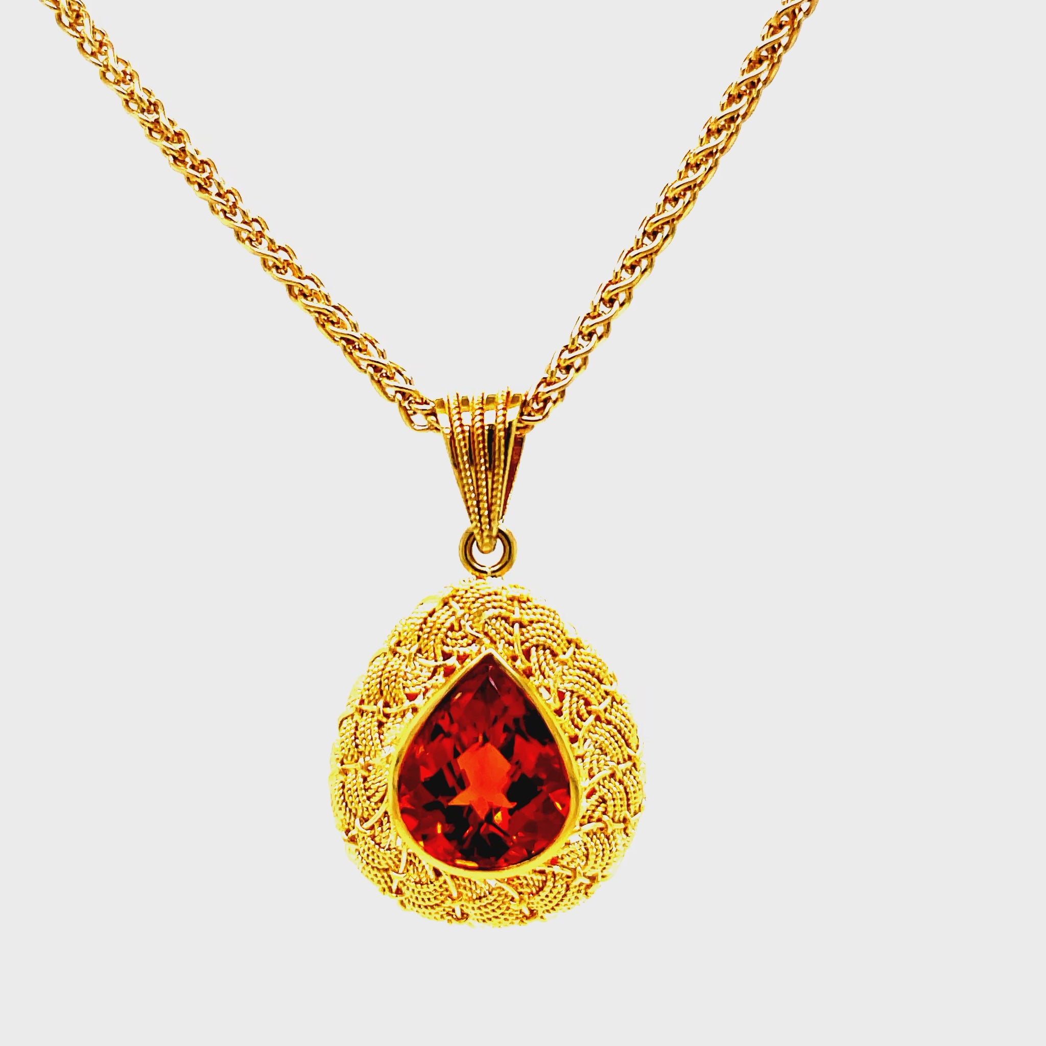 levate your style with our Italian Made Trillion Citrine Pendant Necklace. Crafted with 18k yellow gold in a stunning matte finish, this necklace showcases a woven style and a mesmerizing pear shape Madeira citrine. Handcrafted in Italy with attention to detail, it exudes luxury and sophistication.

30.00 mm size&nbsp;

Chain not included ($700)