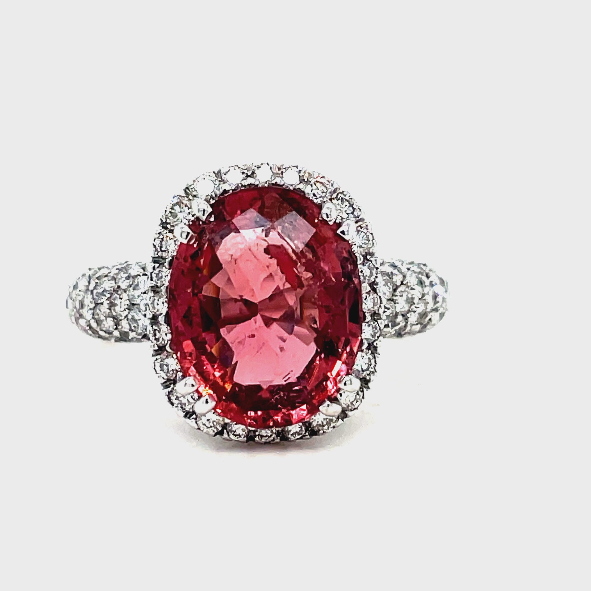 Expertly crafted with a 4.47 carat oval tourmaline and 1.15 carats of diamond pave set in 18k white gold, this ring exudes elegance and luxury. Add a pop of color and sparkle to any outfit with this one-of-a-kind piece.