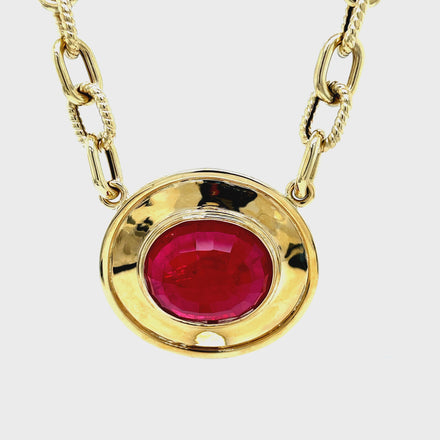 Elevate your look with our Large Oval Ruby Necklace, featuring a stunning 23.00 x 20.00 mm ruby set in a sturdy 14k yellow gold bezel. Handcrafted with care and Italian finesse, this necklace is secured by an elegant lobster catch and a 18" long open link chain