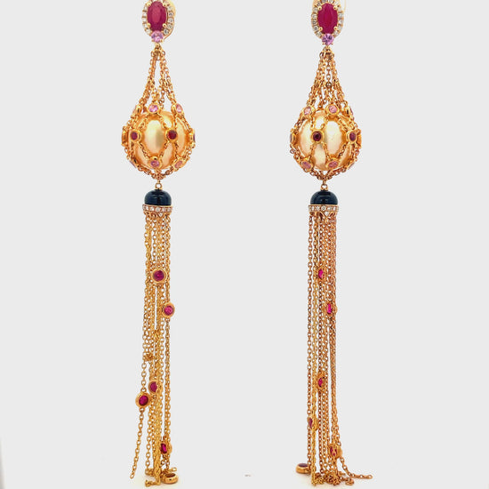 Try on view of 18k Yellow Gold Fancy Long Cultured Pearl Earrings with Rubies and Sapphires 