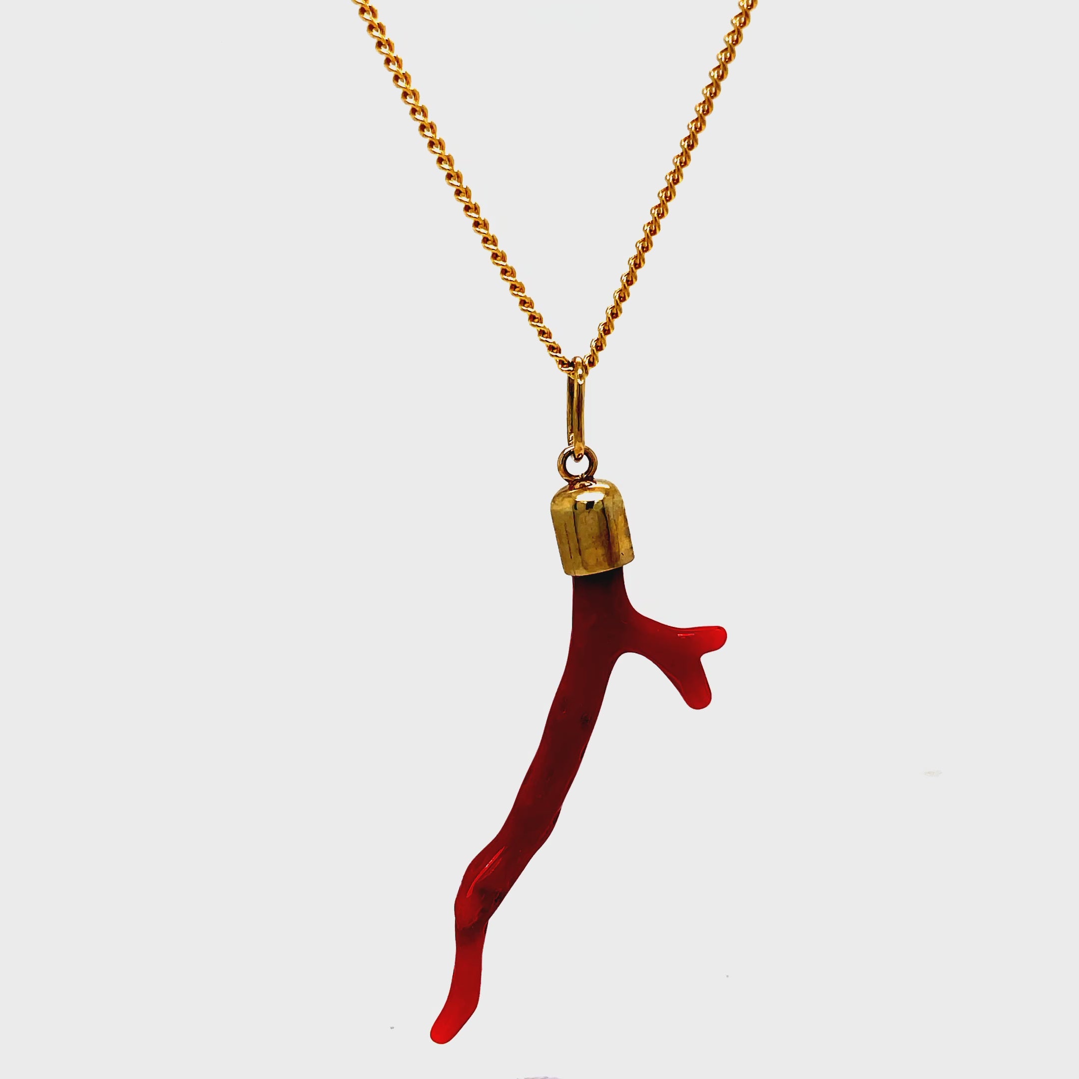 Add a touch of luxury to any outfit with our handmade 18k yellow gold cap pendant necklace featuring a natural red coral branch. This exclusive necklace evokes the beauty of the ocean and embodies the sophistication of our brand. Elevate your style with this elegant and timeless piece.

Chain sold separately $599.00 rolo chain