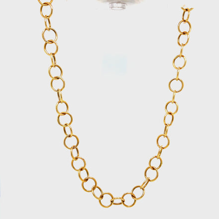 This exquisite 14K yellow gold necklace features a delicate open circle design, secured by a lobster clasp. Crafted for elegance and grace, its 30" length adds a touch of sophistication to any outfit. Upgrade your style with this exclusive 7.00 dwt piece.