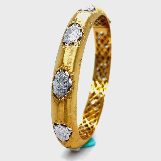 Elevate your style with our Italian 18K Yellow Gold Diamond Bangle Bracelet. Handcrafted with 18K gold, this exquisite piece features round diamonds for a total of 0.50 cts. The brushed finish adds a touch of elegance and sophistication. Indulge in luxury and make a statement with this Italian-made bracelet.