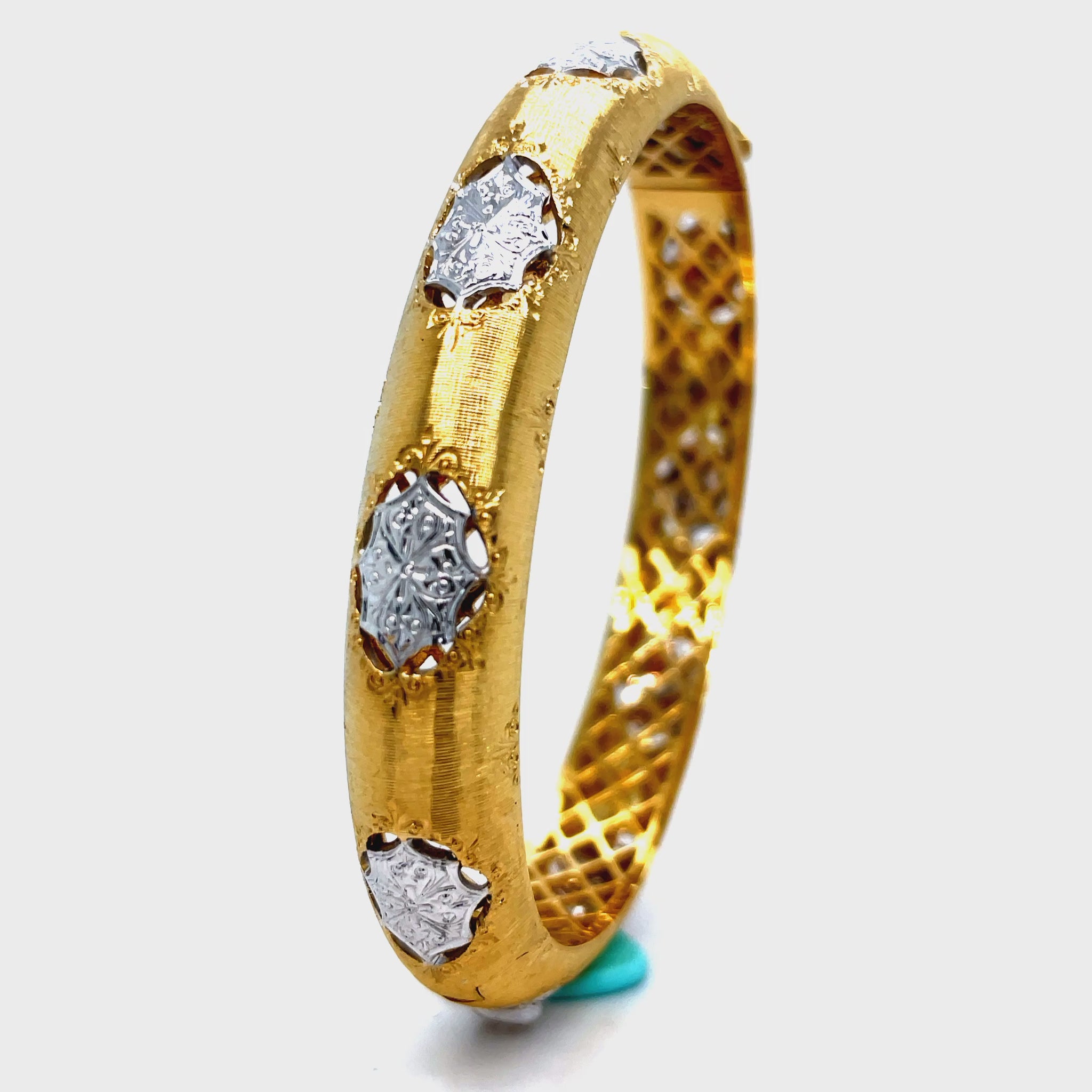 Elevate your style with our Italian 18K Yellow Gold Diamond Bangle Bracelet. Handcrafted with 18K gold, this exquisite piece features round diamonds for a total of 0.50 cts. The brushed finish adds a touch of elegance and sophistication. Indulge in luxury and make a statement with this Italian-made bracelet.