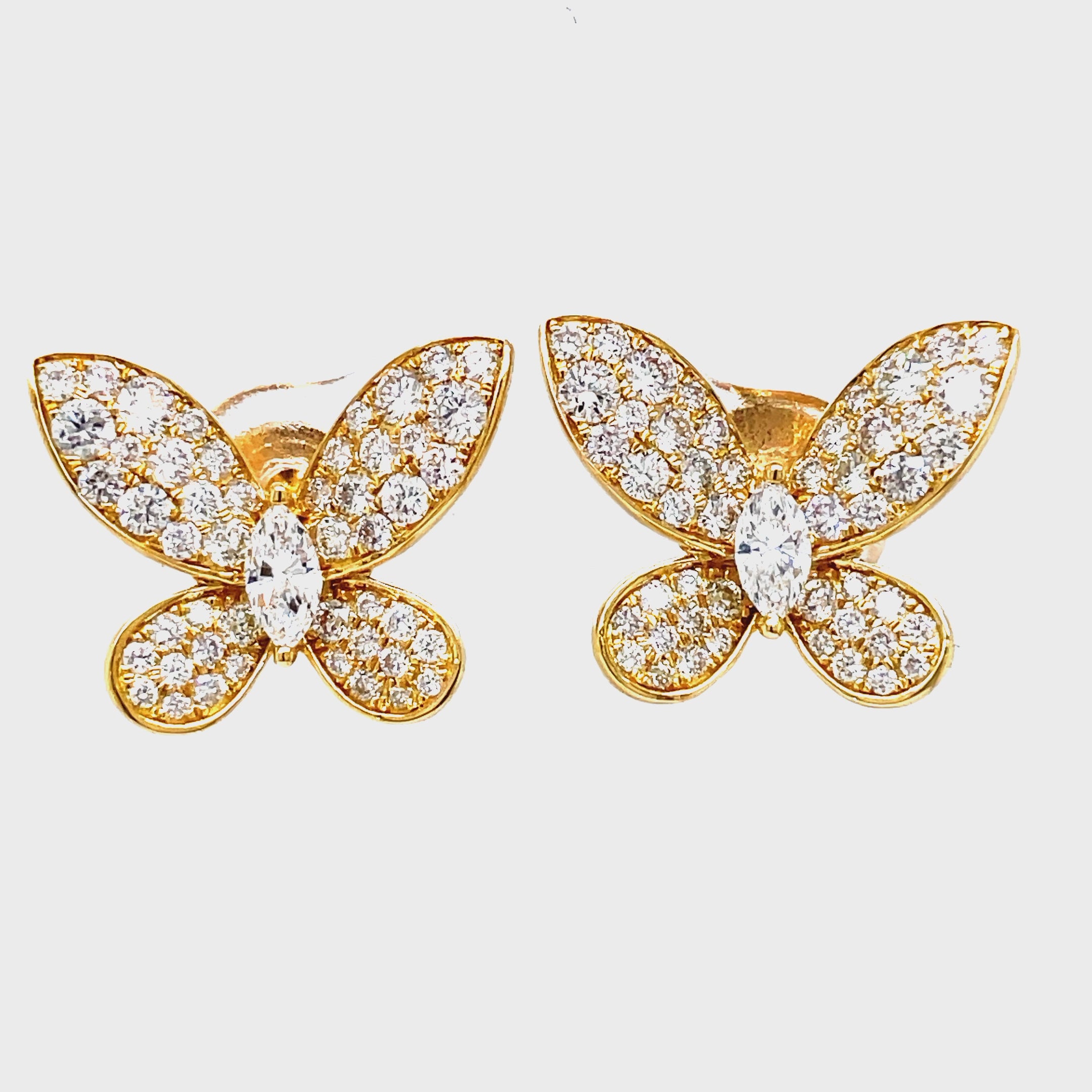 Crafted with exquisite 18k yellow gold and adorned with sparkling round diamonds totaling 1.34 cts, these Medium Size Diamond Butterfly Stud Earrings are a true expression of luxury. The unique combination of round and marquise diamonds creates an elegant butterfly shape that is secured with friction backs, ensuring a comfortable and secure fit. Perfect for adding a touch of sophistication and glamour to any outfit.