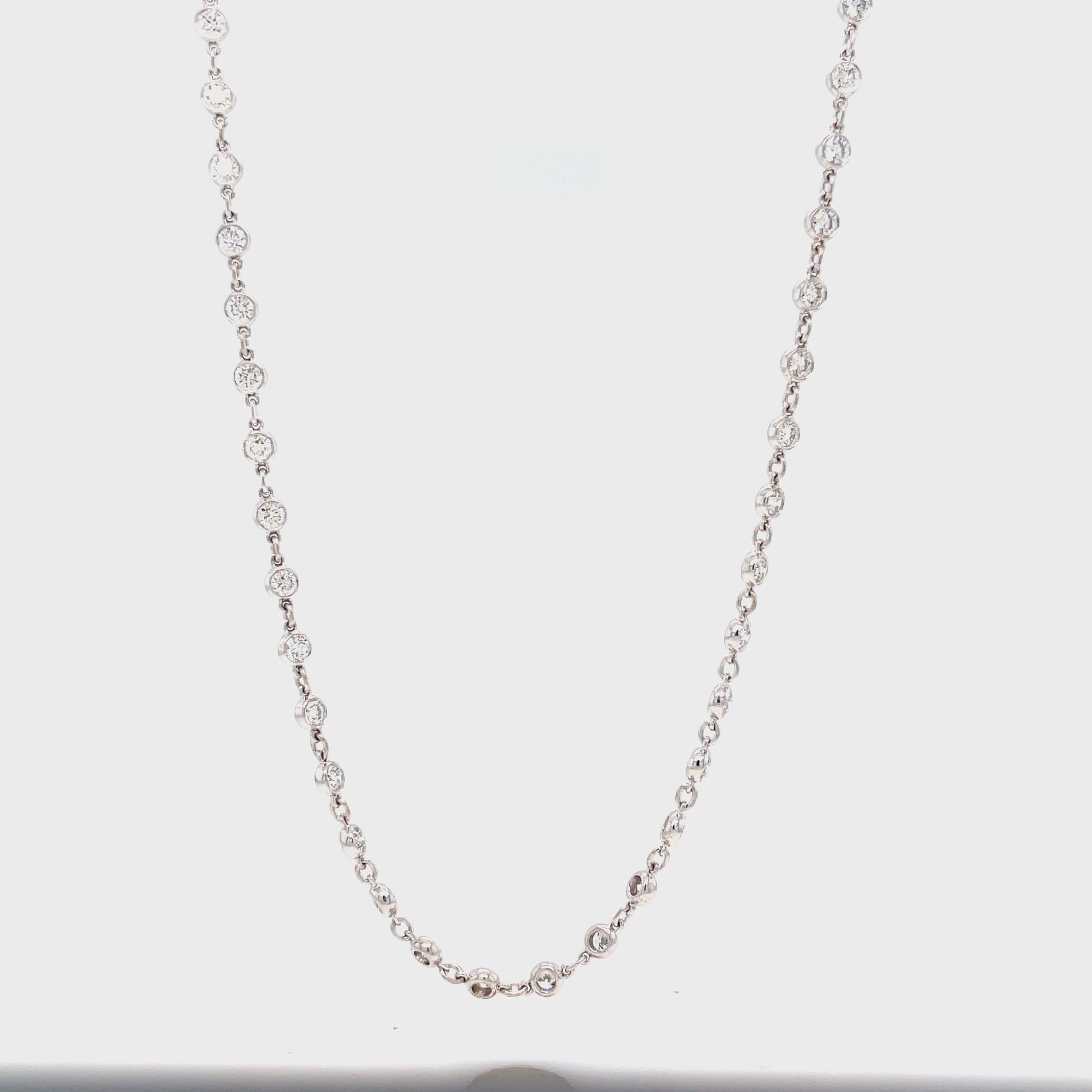 Transform any outfit into a glamorous statement with our Diamonds By the Yard Chain Necklace. Adorned with 60 round diamonds totaling 4.14 carats, this 18k white gold necklace is 18" long, providing the perfect balance of sparkle and elegance. Elevate your style with this luxurious piece.