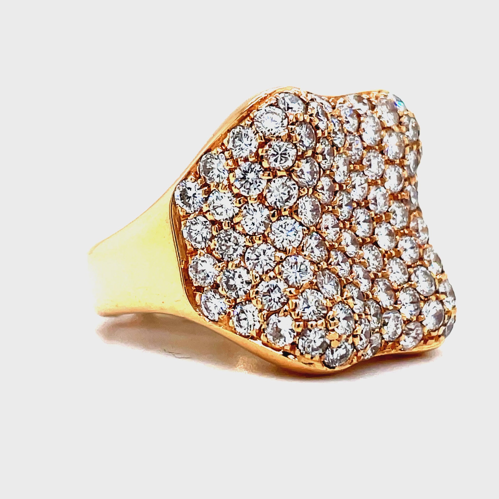 levate your style with our Italian-made Diamond Pave Cocktail Wide Rose Gold Ring. Crafted from luxurious 18k rose gold, this masterpiece features a stunning diamond pave setting of 3.37 carats. With a gallery finish, this ring radiates sophistication and elegance. Upgrade your jewelry collection today.