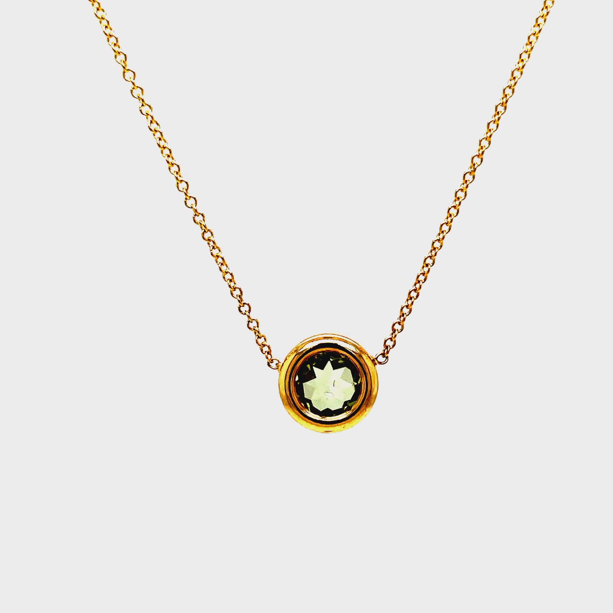 Indulge in the exquisite luxury of our Praziolite Gold Bezel Pendant Necklace. Adorned with a round praziolite gemstone and crafted from 14k yellow gold, this necklace exudes elegance. The delicate 1.1 mm gold chain adds a touch of sophistication. Elevate any outfit with this 18" long necklace.