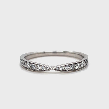 This stunning Estate Tiffany and Co. Diamond Wedding Band features a unique v-shape design adorned with brilliant round diamonds. Crafted from luxurious platinum, this band is an elegant and exclusive choice for your special day. Add a touch of sophistication and luxury to your wedding ensemble with this one-of-a-kind piece from Tiffany and Co.