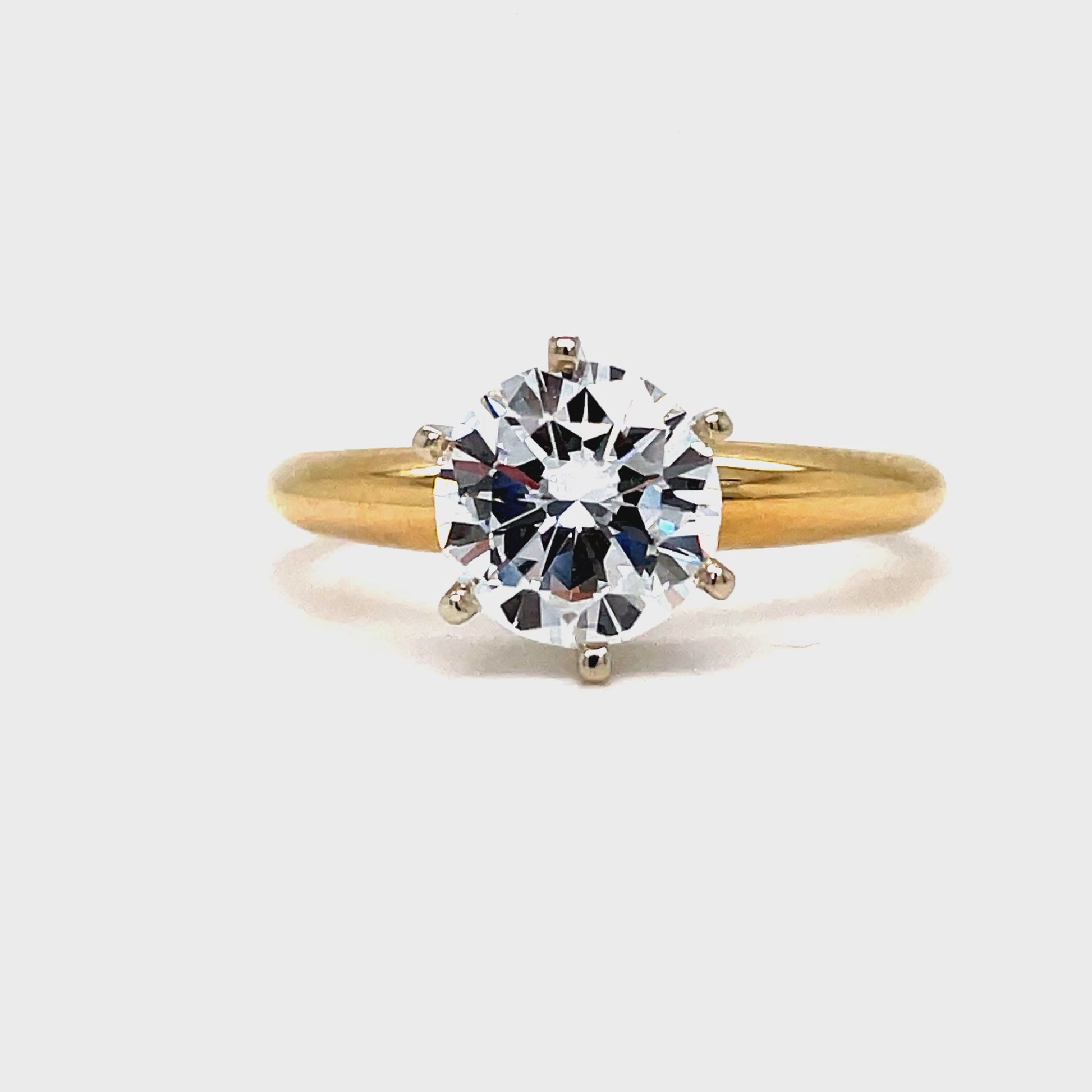 This exquisite Solitaire Round Brilliant Diamond boasts 1.60 carats of elegance. Its round cut and color E clarity VVS1 create a dazzling sparkle that is set in a luxurious 6 prong yellow gold band. Indulge in the ultimate display of refined beauty.