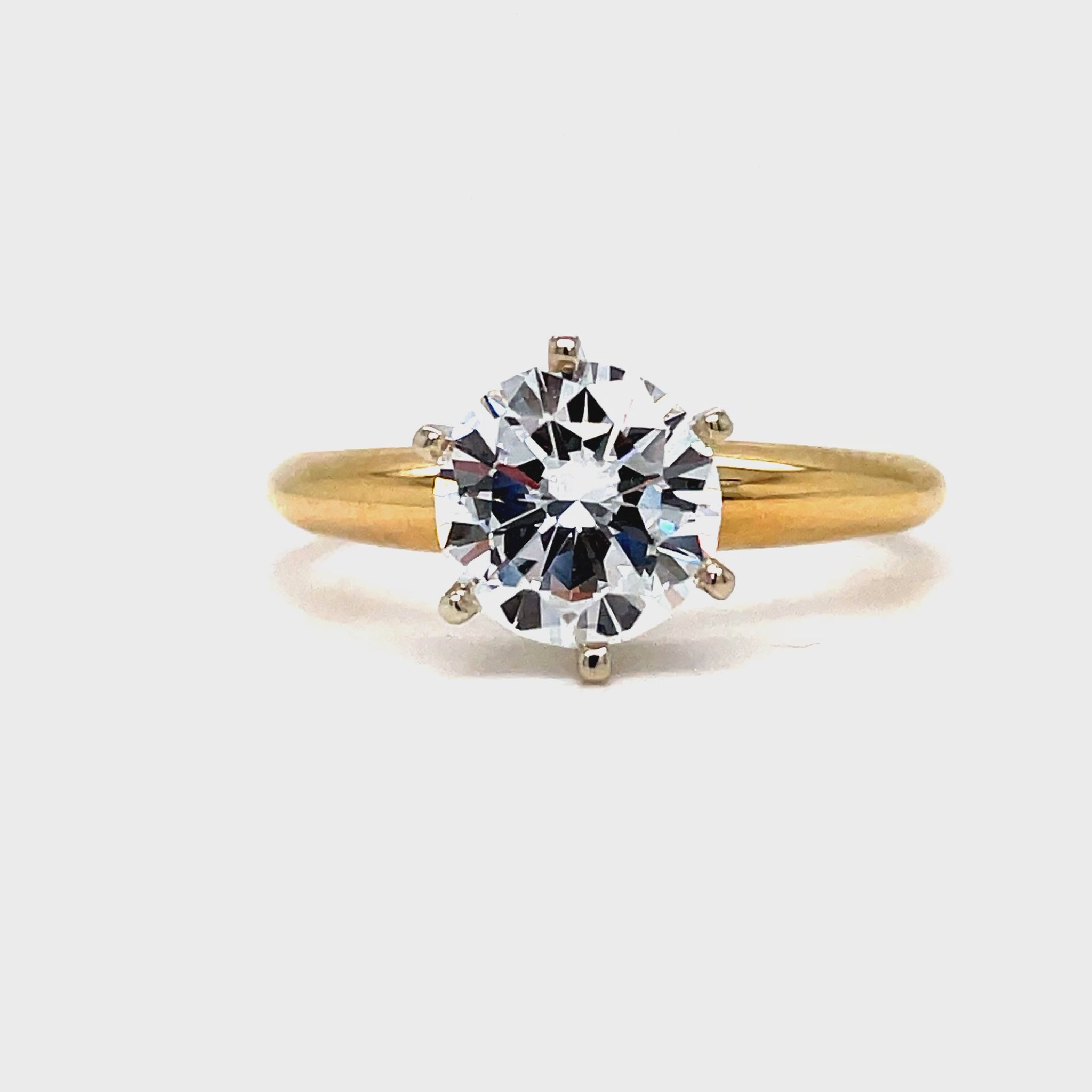 This exquisite Solitaire Round Brilliant Diamond boasts 1.60 carats of elegance. Its round cut and color E clarity VVS1 create a dazzling sparkle that is set in a luxurious 6 prong yellow gold band. Indulge in the ultimate display of refined beauty.