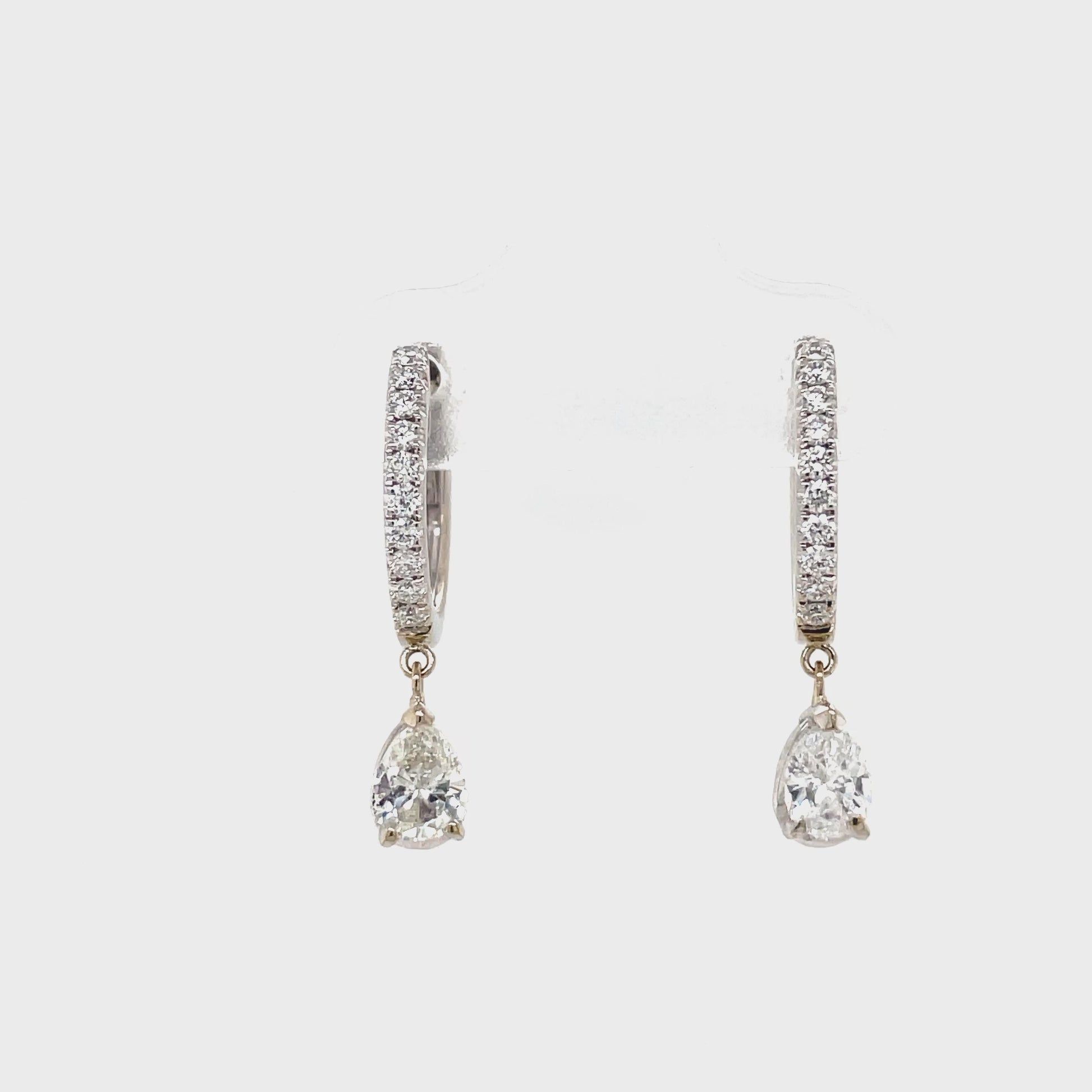 Front and Side View of Pear Shape Diamond Dangling Earrings