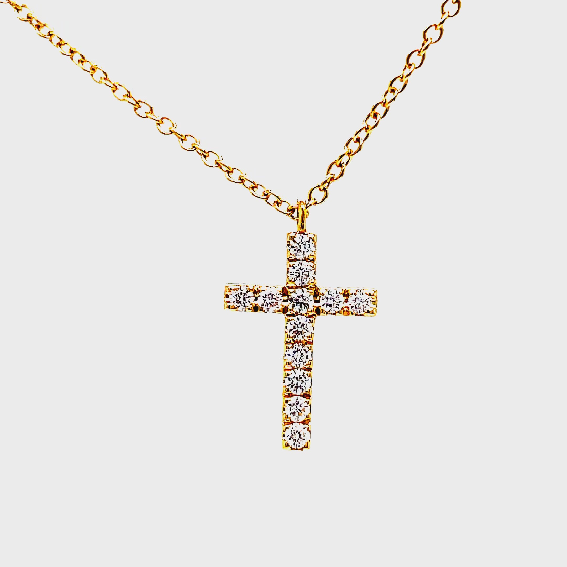 Indulge in the opulence of our 18K Italian Made Reversible Diamond &amp; Pink Sapphire Cross Pendant Necklace. Handcrafted with 18k yellow gold, this luxurious piece features a reversible cross adorned with 0.21 cts of sparkling diamonds on one side and 0.25 cts of deep pink sapphires on the other. Complete your look with the included 18" yellow gold chain. Elevate your style with this exquisite necklace.