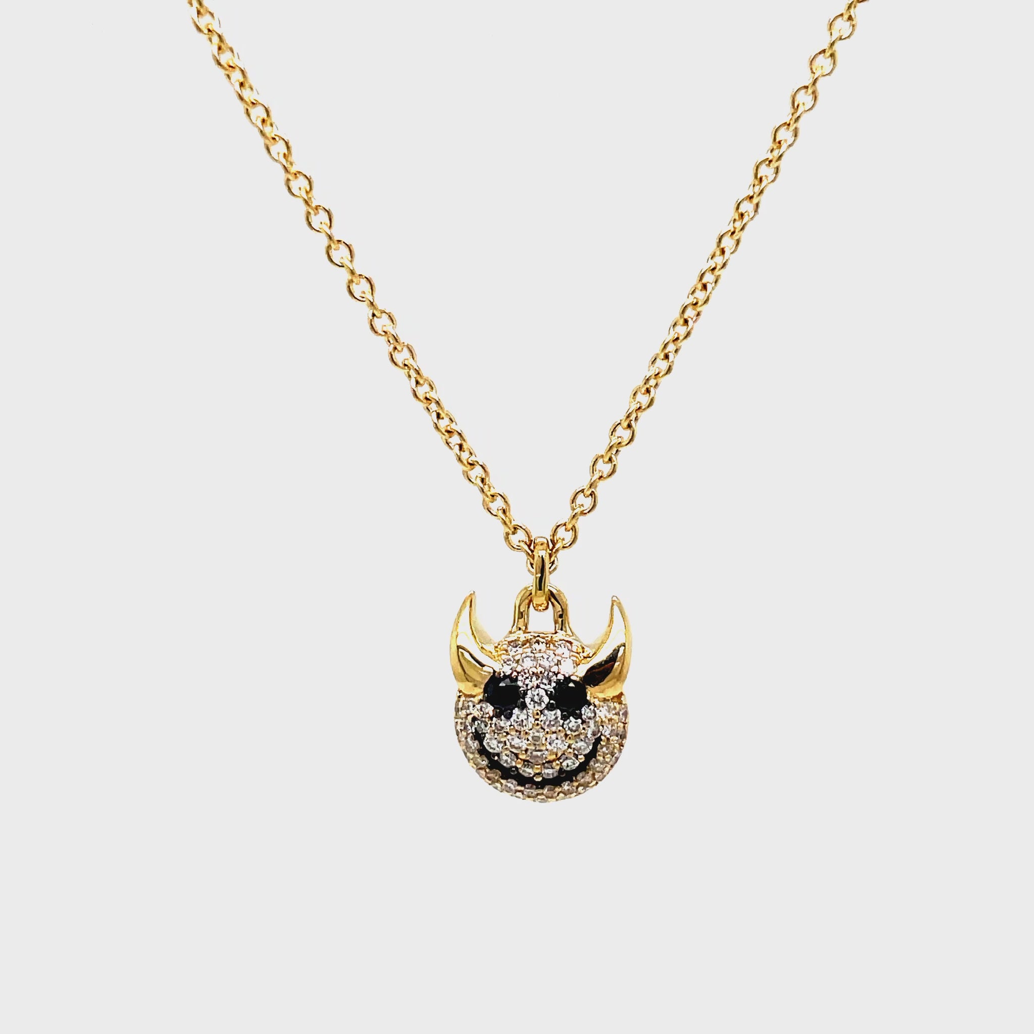 levate your style with our 14K Yellow Gold Black Diamond Little Devil Charm Pendant. This exclusive piece features a devil charm made of 14k yellow gold and encrusted with 0.29 cts of round diamonds. The deluxe diamond lobster clasp makes it easy to wear and adds a touch of luxury to any outfit.