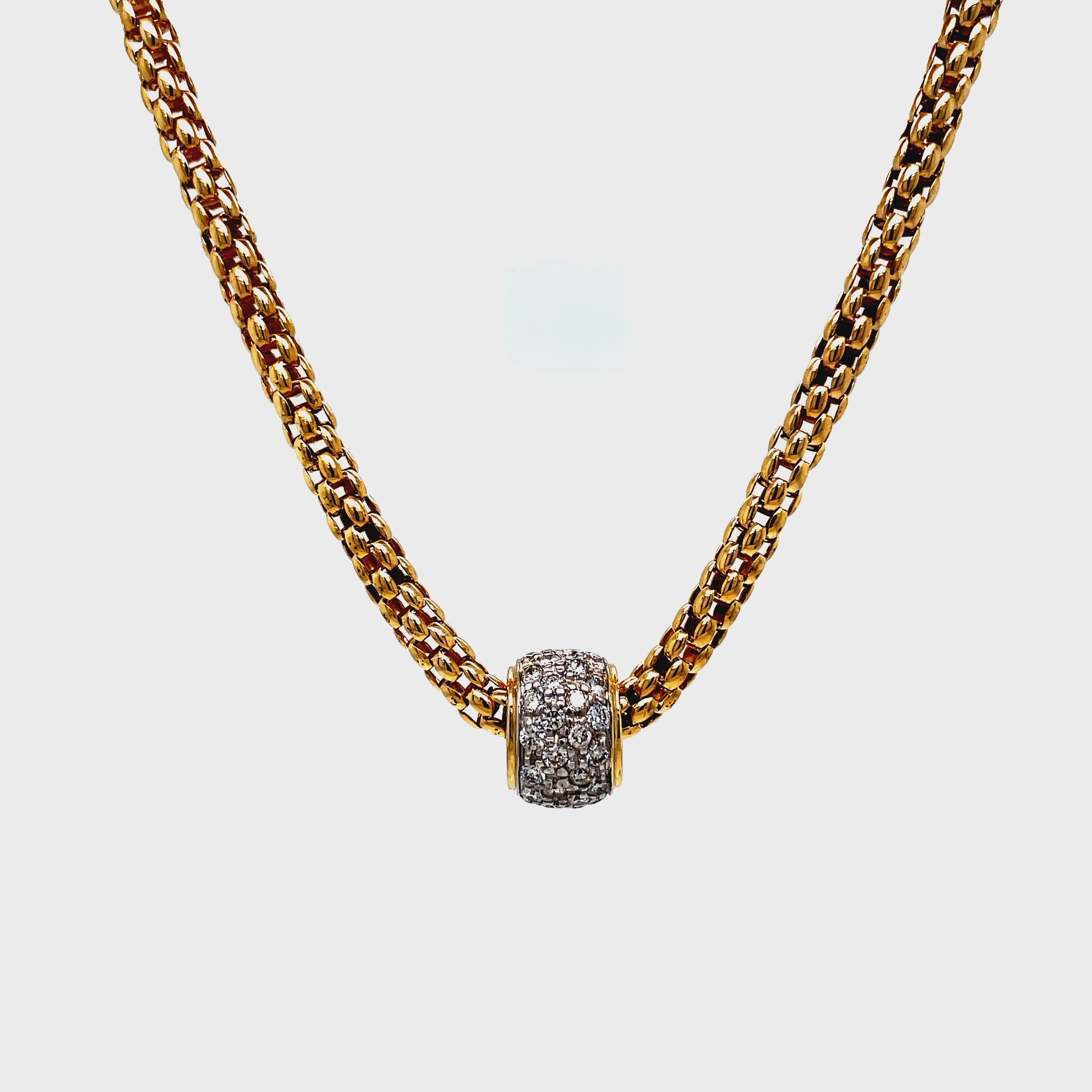 ndulge in elegant luxury with our Yellow Gold Diamond Slide Pendant Necklace. Crafted from 14k yellow gold, this necklace features a stunning diamond pave set slide on a 17" popcorn link chain. The secure lobster clasp ensures a worry-free wear, making it the perfect addition to your sophisticated jewelry collection.