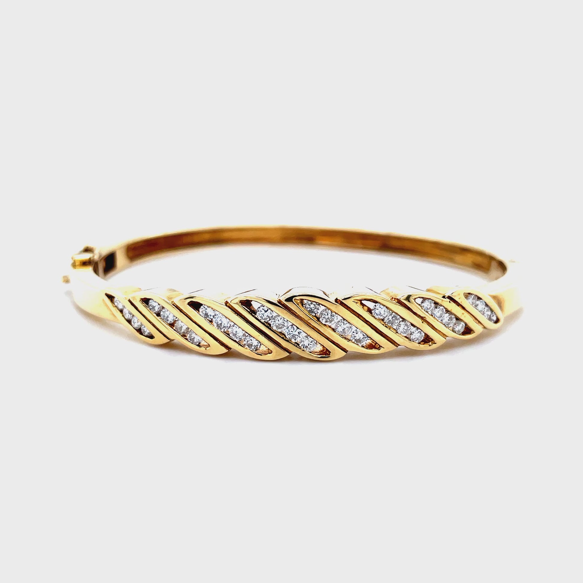 Try on video of Estate Collection 14k Yellow Gold Diamond Bangle Bracelet