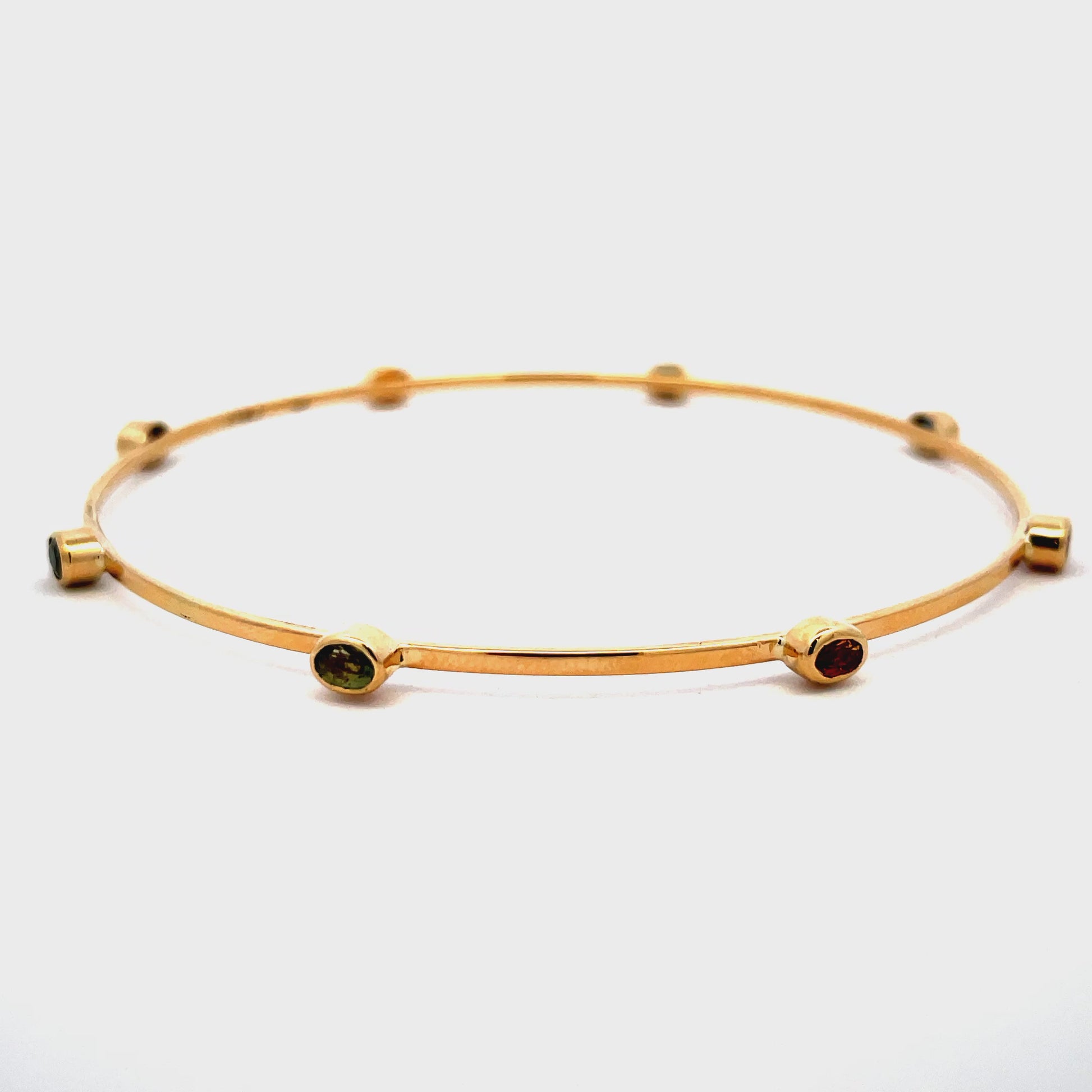 Try on video of 14k Yellow Gold Multicolor Sapphire Bangle 