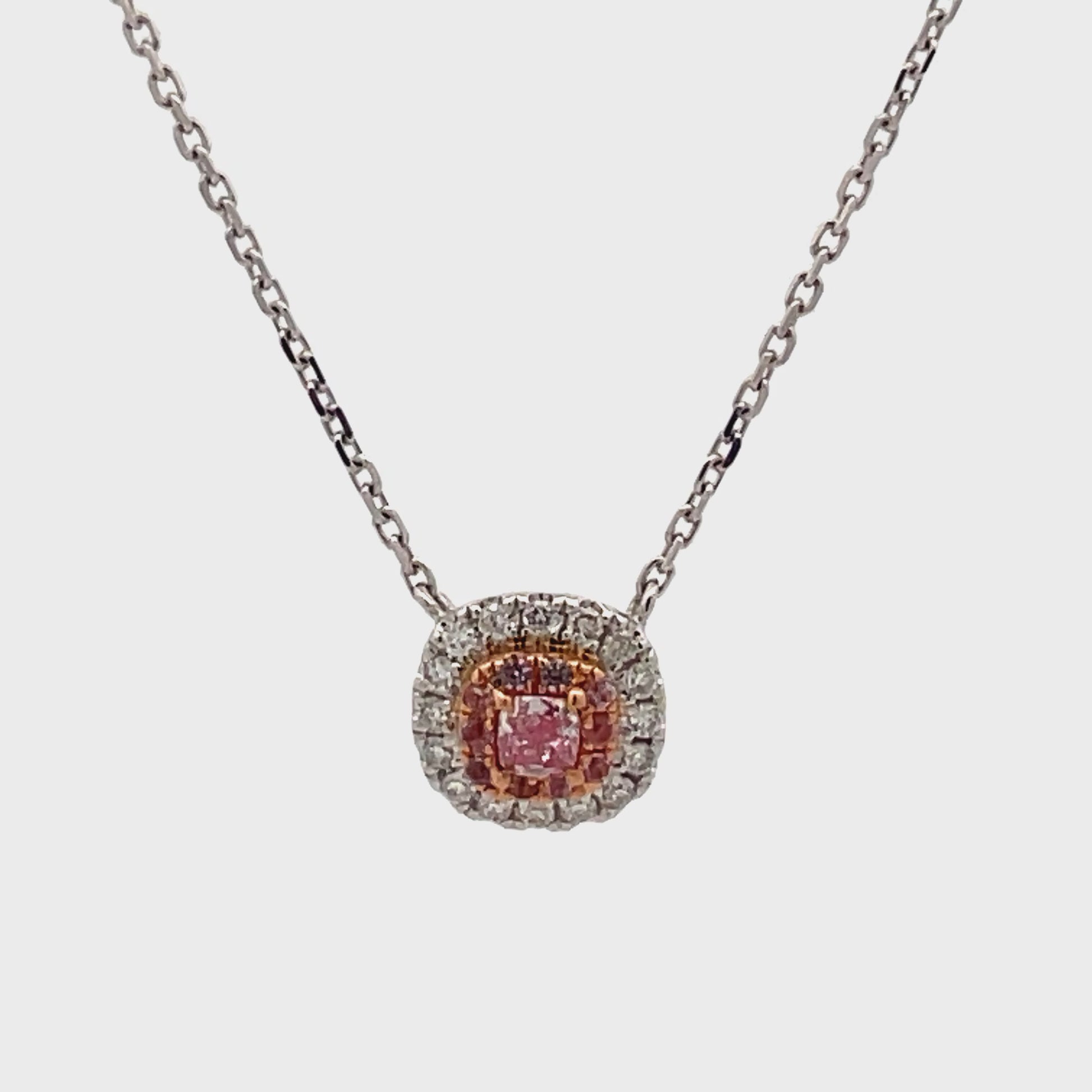 Watch video of front view and side view of Fancy Pink Diamond and Diamond Bezel Pendant Necklace 