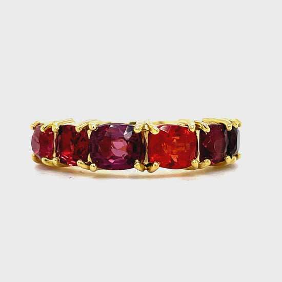 ndulge in the ultimate luxury with our Multicolor Sapphire Band Ring. Crafted from 18k yellow gold, this exclusive piece boasts 6 stunning multi-colored sapphire stones, set in exquisite anniversary bands. Elevate any look with this sophisticated and elegant addition to your jewelry collection.