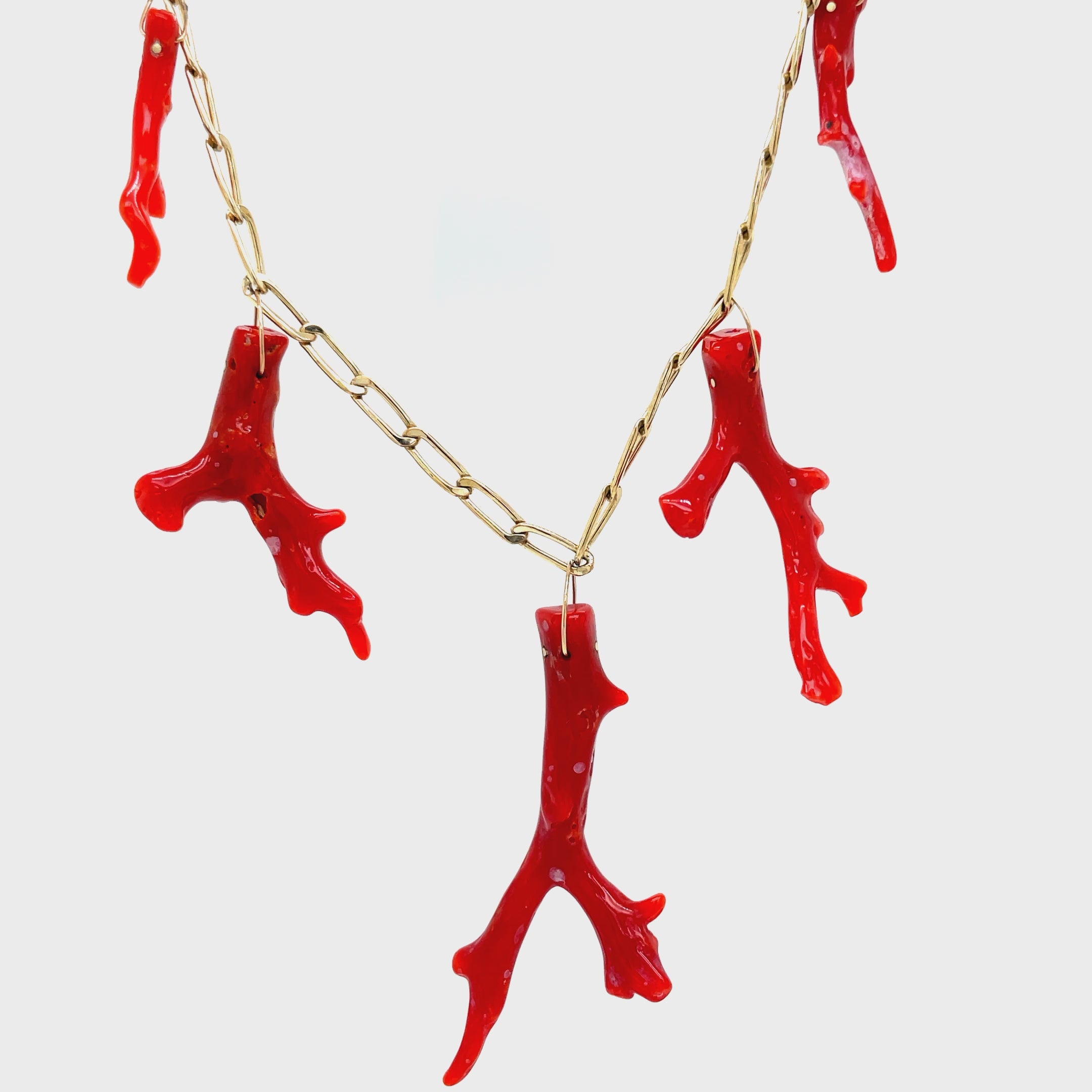 Elevate your jewelry collection with our Five Red Coral Branch Gold Cap Pendant. Crafted with 14k yellow gold and five vibrant red coral branches, this luxurious pendant exudes sophistication and exclusivity. The elegant paperclip chain link and secure lobster catch add a touch of modernity to this timeless piece. Make a statement with this exquisite pendant.