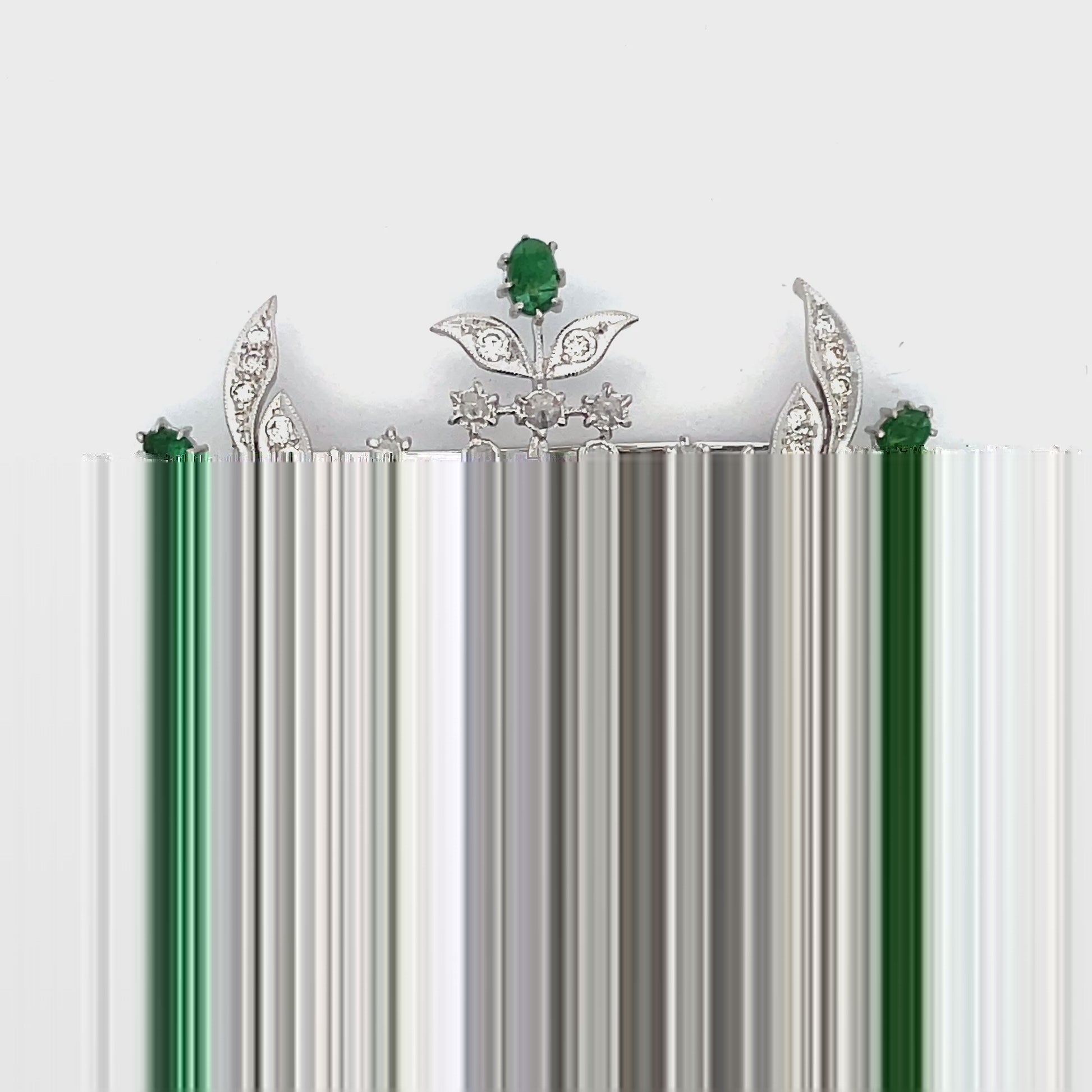 Try on video of Estate 18k White Gold Emerald Cabochon and Rose Cut Diamond Brooch