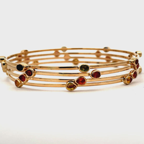 Try on video of 14k Yellow Gold Multicolor Sapphire Bangles