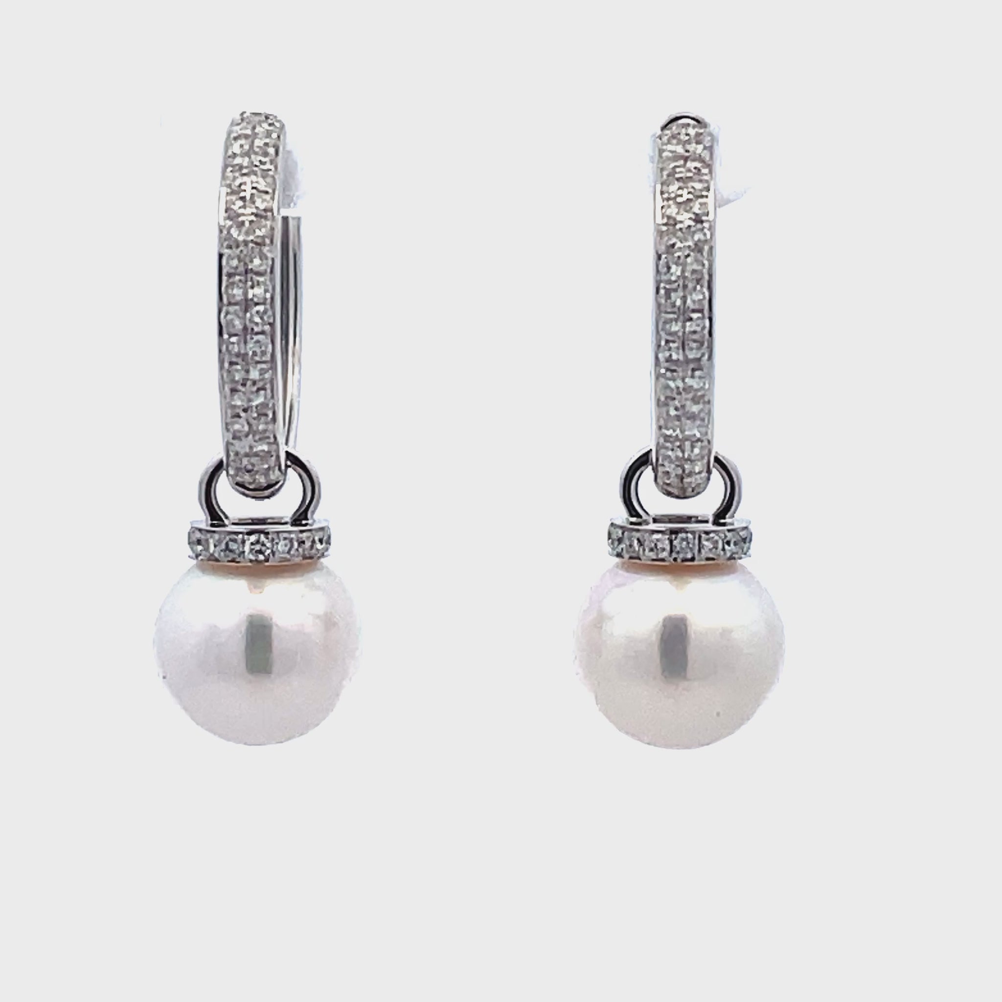 Try on video of 14k White Gold Diamond Huggie Pearl Earrings