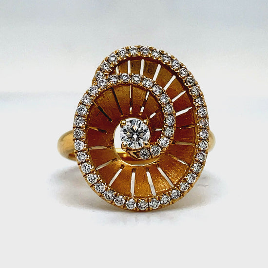 Elevate any look with our Spiral Diamond Ring crafted in 18k yellow gold. The round diamonds, totaling 0.55 cts, add a touch of brilliance to this luxurious piece. A sophisticated choice for the discerning individual who appreciates the finer things in life.