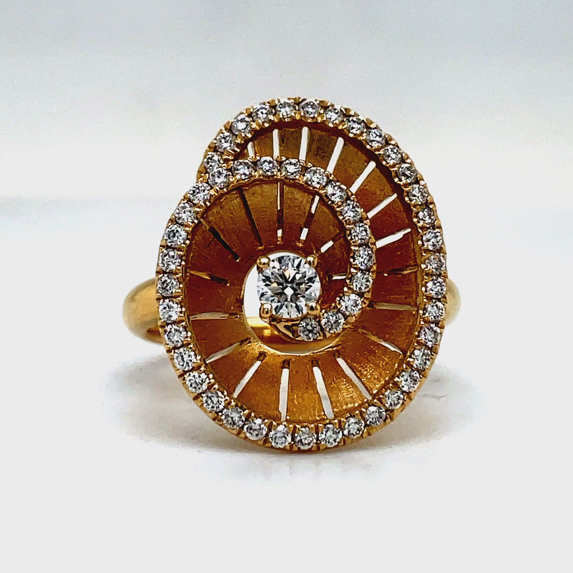 Elevate any look with our Spiral Diamond Ring crafted in 18k yellow gold. The round diamonds, totaling 0.55 cts, add a touch of brilliance to this luxurious piece. A sophisticated choice for the discerning individual who appreciates the finer things in life.