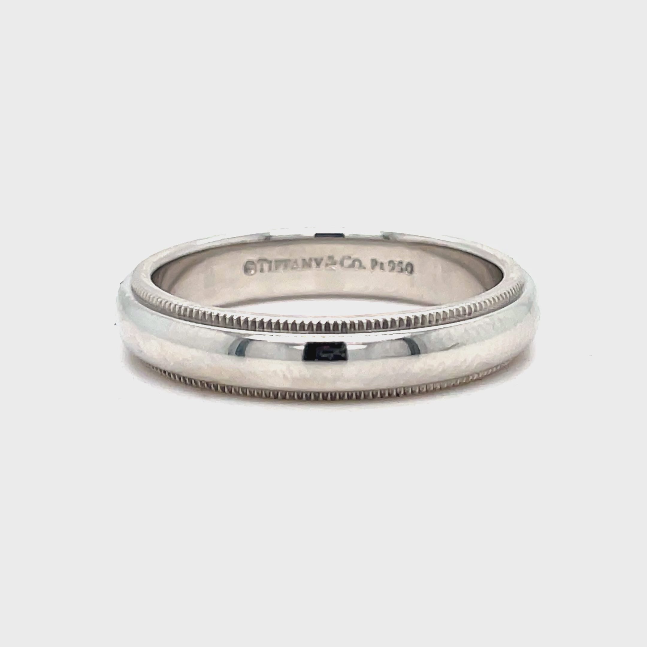 ndulge in timeless elegance with our Estate Tiffany and Co. Milgrain Wedding Band. Crafted by the renowned Tiffany &amp; Co., this ring features a delicate milgrain design and is made with the finest platinum. Measuring 4.00 mm wide, it is the perfect symbol of everlasting love and luxury.