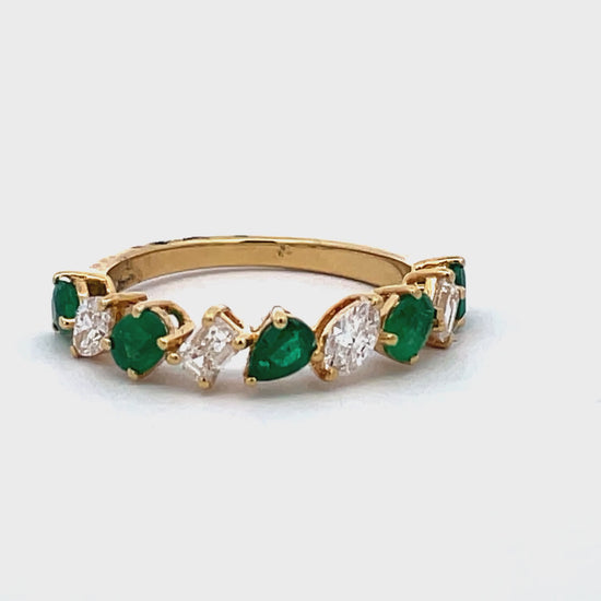 Try on view of 18k Yellow Gold Pear Shape Emerald Cut and Marquise Diamond Ring