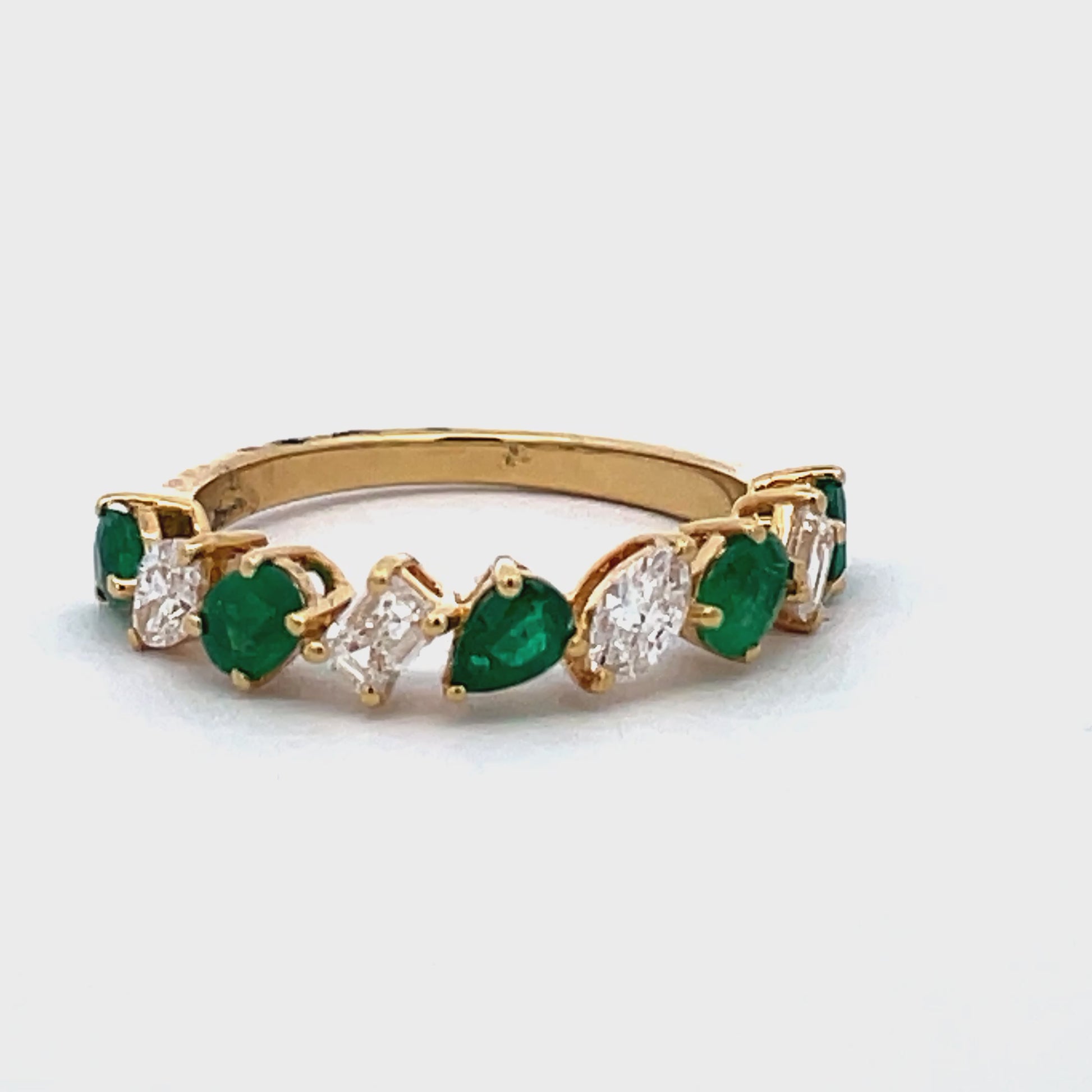 Try on view of 18k Yellow Gold Pear Shape Emerald Cut and Marquise Diamond Ring