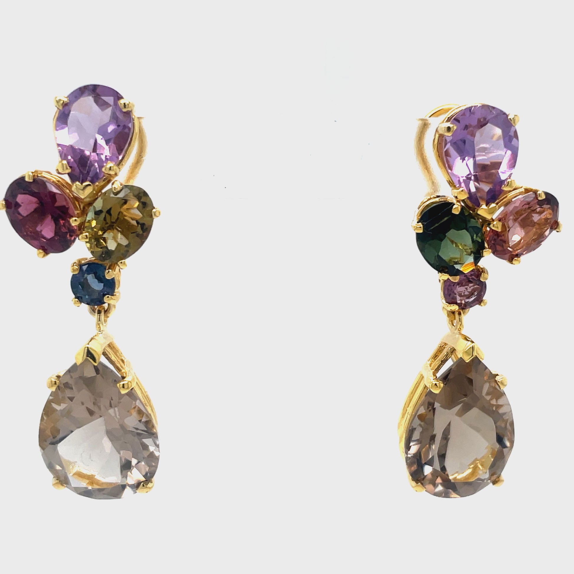 Experience elegance with these stunning 14k yellow gold Tourmaline &amp; Amethyst Drop Earrings. The secure omega clip provides comfort and ease, while the tourmaline and amethyst stones offer a touch of natural beauty. Perfect for any occasion, these earrings will elevate any outfit and make you feel confident and chic.