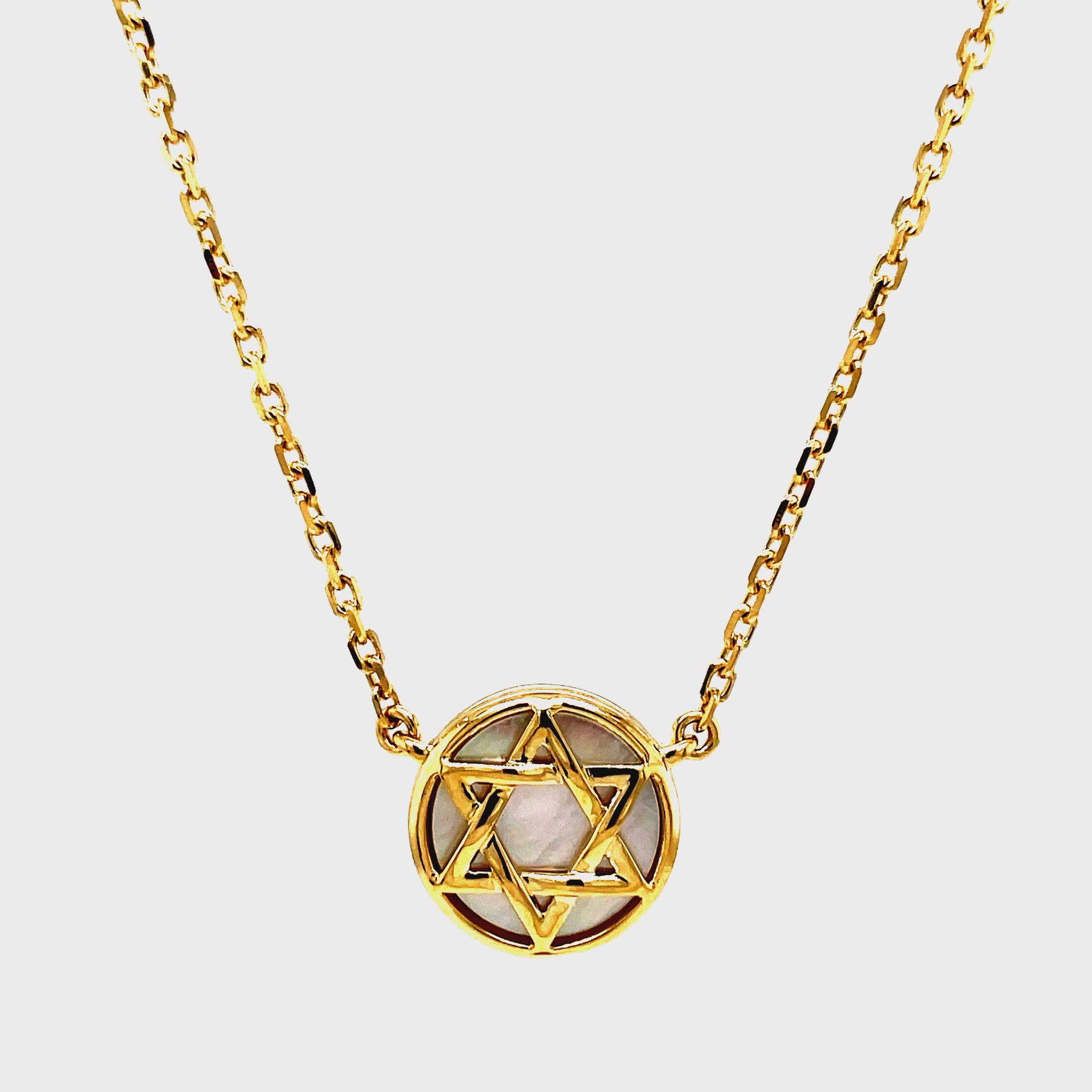 Discover the beauty of our 14k MOP Star of David Necklace. Handcrafted with 15.00 mm of 14k yellow gold and adorned with solid mother of pearl background. The 18" long chain features a secure lobster clasp with a sizing loop at 16", ensuring a perfect fit. Elevate your style and embrace luxury with this exclusive piece.