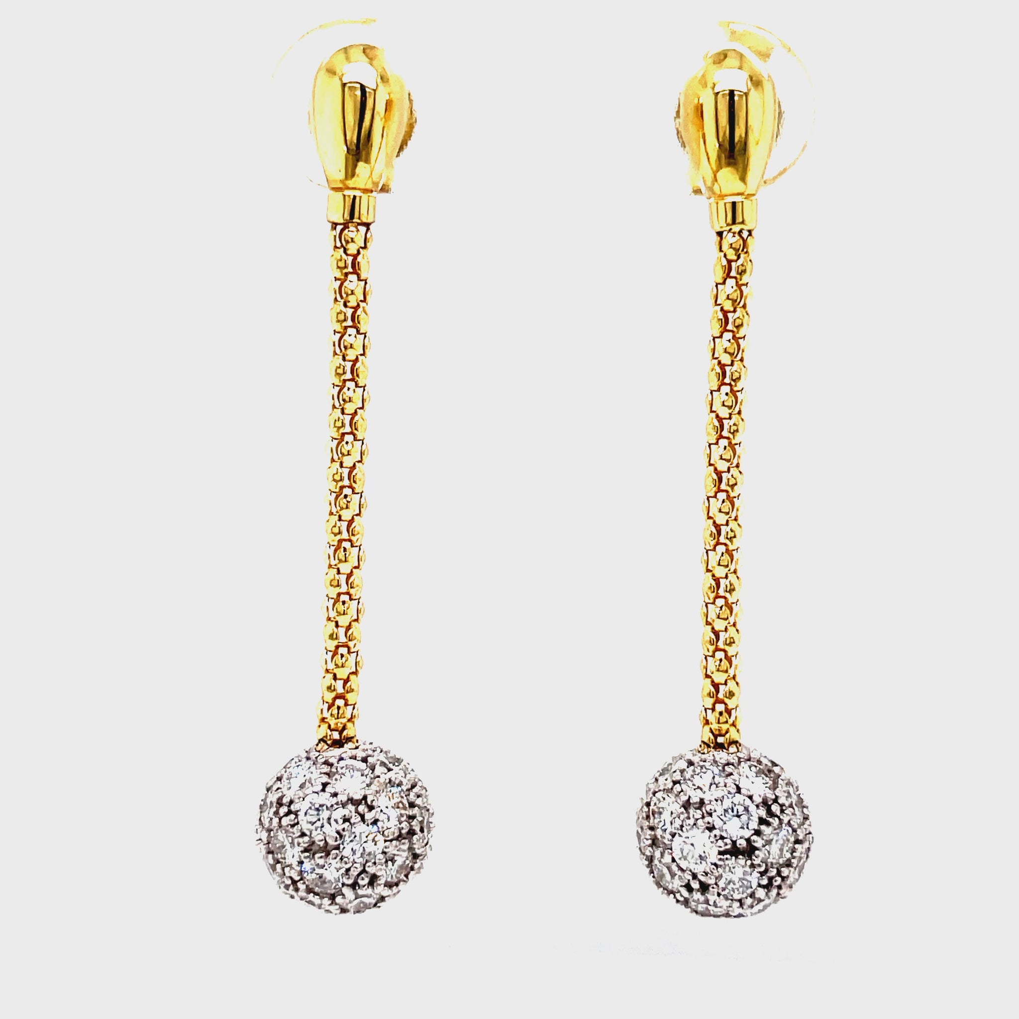 Indulge in luxury with our 18k Yellow Gold Diamond Long Earrings from Stella Milano. These elegant drop earrings feature diamond ball accents and sparkling pave diamonds, all set in stunning 18k yellow gold. With secure friction backs, you can wear them with confidence to any occasion. Elevate your look with these exclusive earrings.