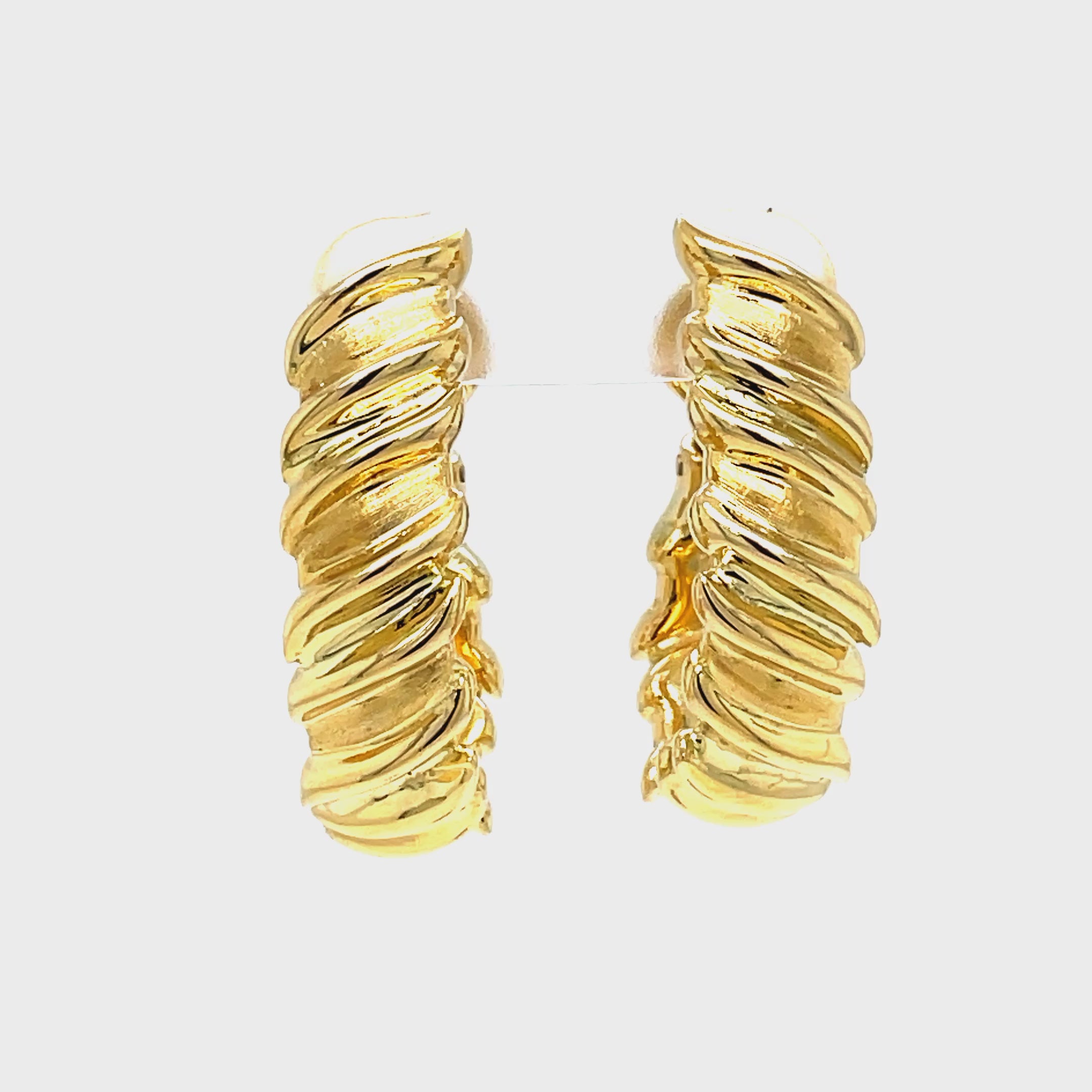 Effortlessly elevate your style with our Large Yellow Gold Hoop Ma. Crafted in Italy with 18k yellow gold, these earrings feature a unique omega system for easy wear and a fancy style that adds a touch of luxury to any outfit. Upgrade your jewelry collection with this exclusive piece.