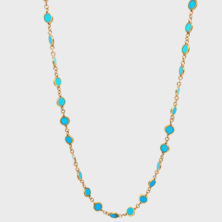 Elevate your style with our Turquoise Disk Necklace. Crafted with 14k yellow gold, this elegant piece features a solid disk suspended on an 18" chain. Adding a touch of sophistication to any ensemble, this necklace is a must-have for any discerning fashionista.