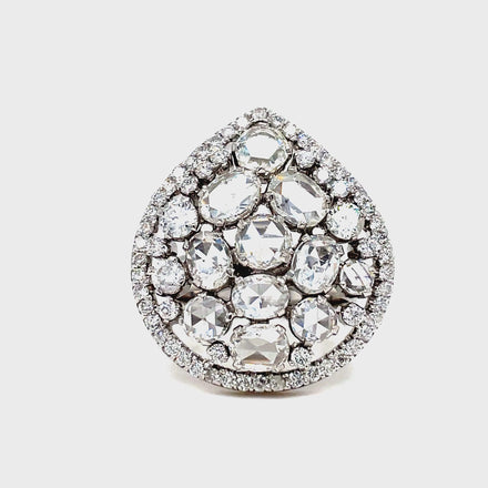 ndulge in timeless elegance with our Rose Cut Diamond Cluster &amp; Round Diamond Ring. Crafted with exquisite rose cut and round diamonds totaling 5.30 carats, this pear-shaped ring is the epitome of luxury. Set in 18k white gold, it's the perfect accessory for any special occasion.