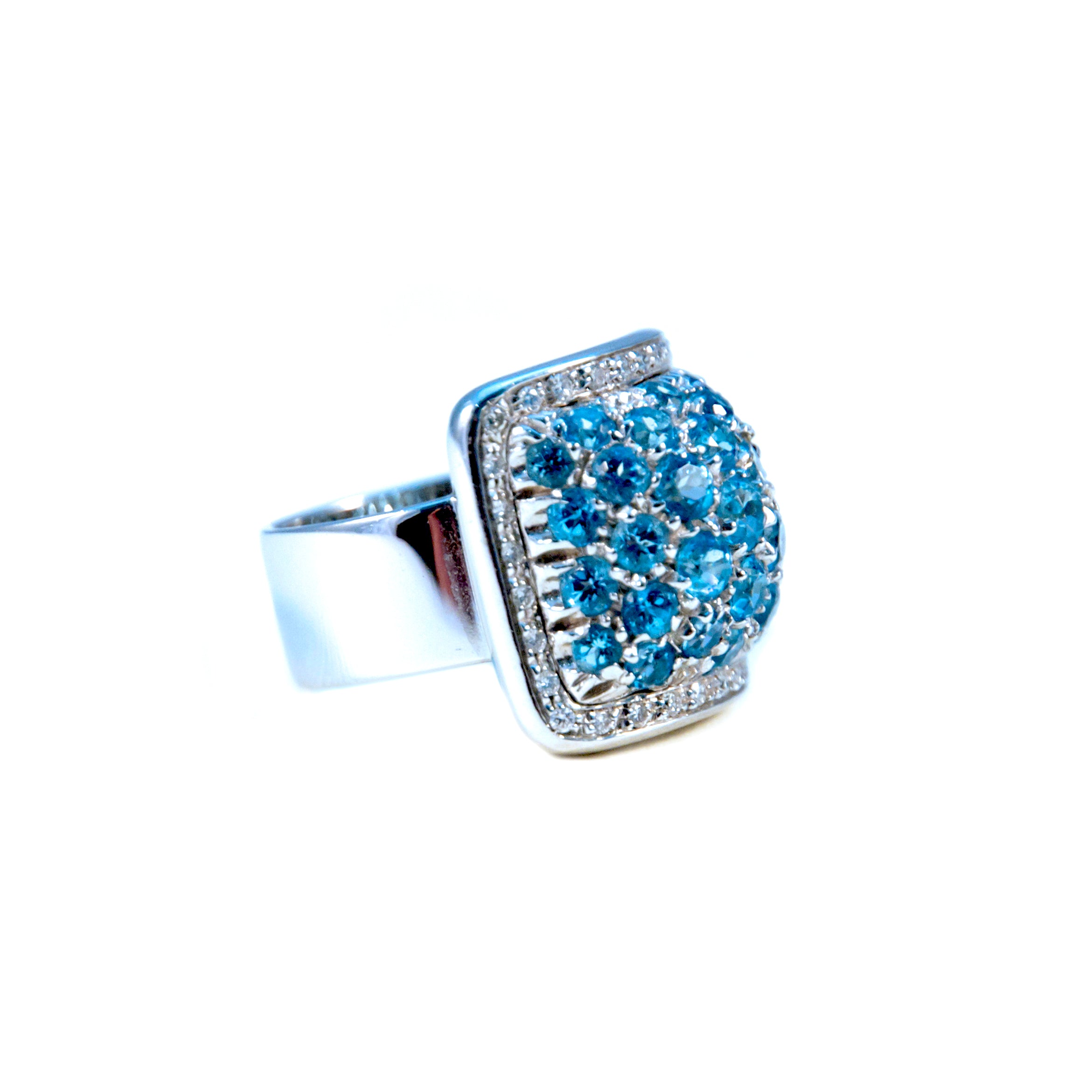 This 18k white gold Italian-made Dome style ring from the Pascale Bruni Collection features a 2.0 carat Blue Topaz and 1.0 carat of Round Diamonds, with a thick shank.