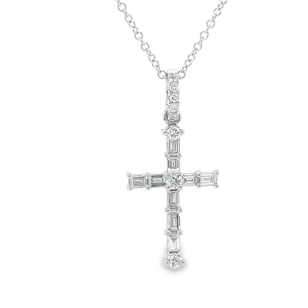 Luxurious 18k white gold crafted into a stunning cross pendant, embellished with top-grade E/F-VS1 color diamonds of 0.25 carats. Sparkling and securely suspended on a 16" chain of 1.1 mm width (chain is optional at $199).