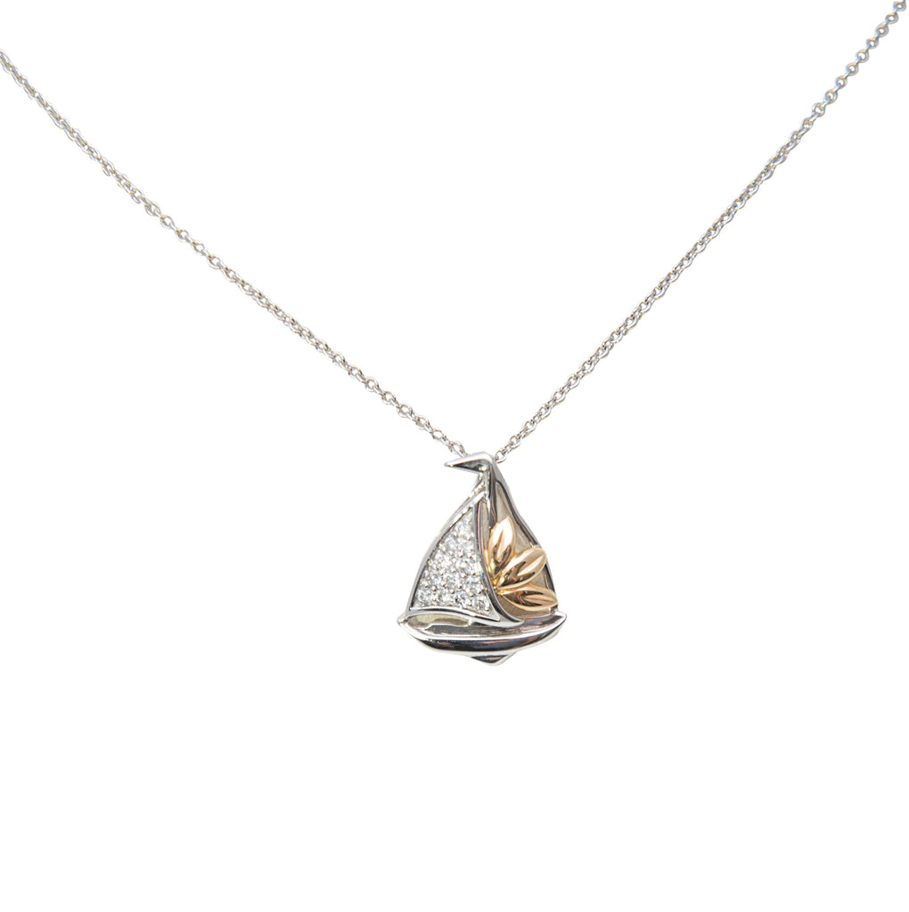 14k white & yellow gold sailboat necklace. 1/2" x 1/2". round diamonds 0.15 cts  18" white gold chain is optional $205.00