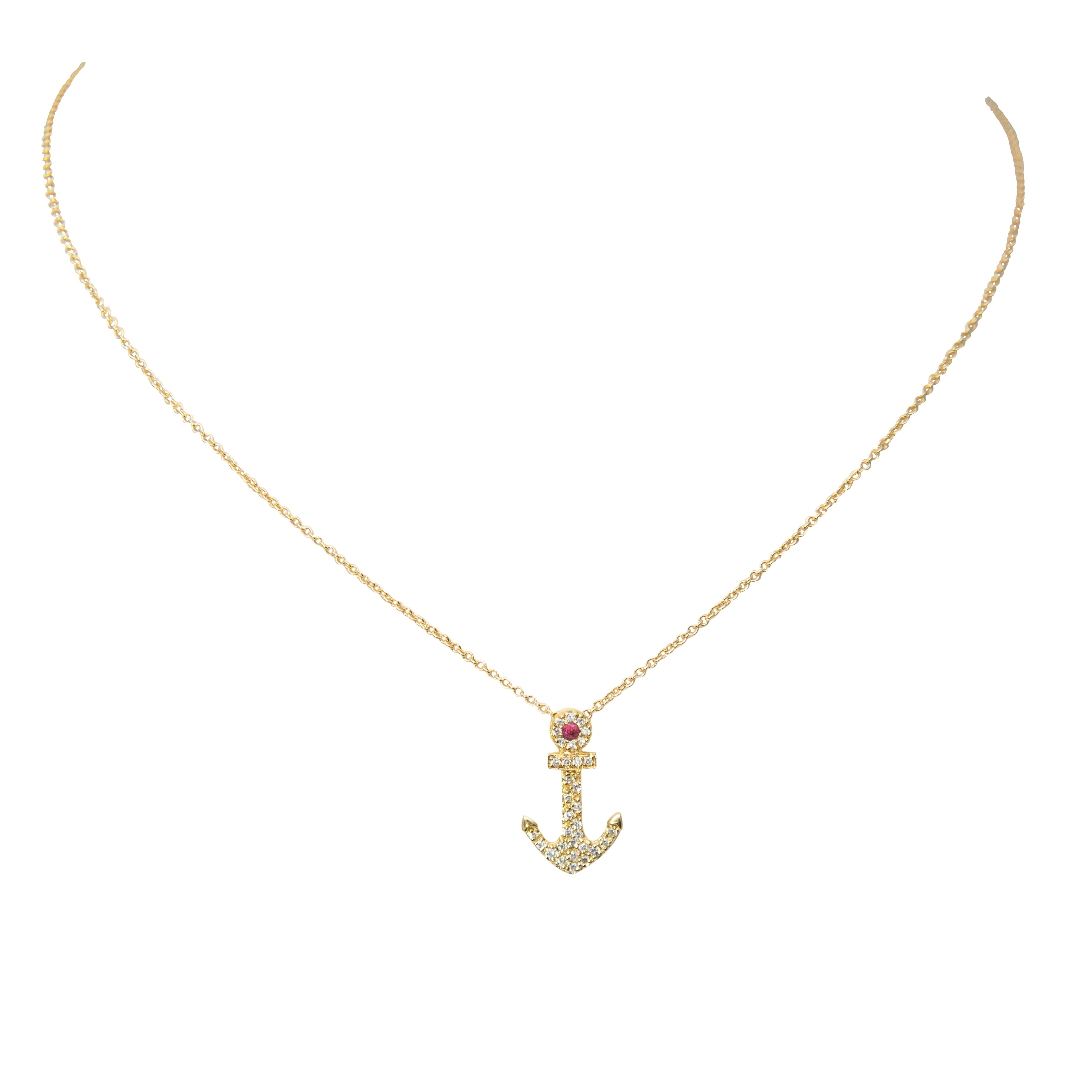 Gleaming 18K yellow gold encases a diamond-studded, ruby-adorned anchor pendant, suspended by a secure 16" yellow gold chain. 0.12cts of diamond and one small ruby sparkle within the intricately-crafted bail, creating a stunning addition to any look.