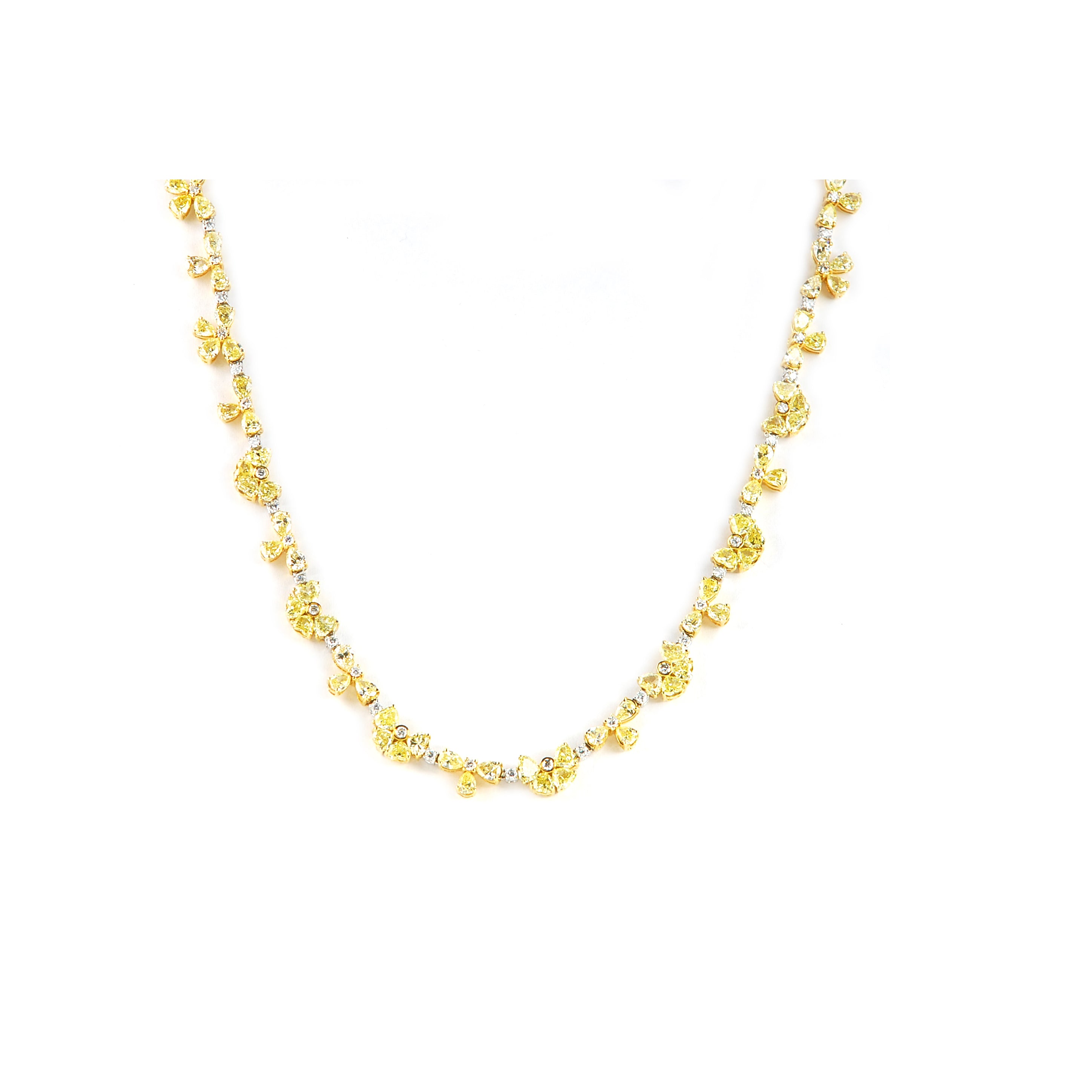 Stunning yellow diamond flower shape necklace.  Set in 18k yellow & white gold.  112 pear shape fancy yellow diamonds 23.26 cts  64 round white diamonds 2.10 cts   Secure clasp with figure 8 for safety  17" long