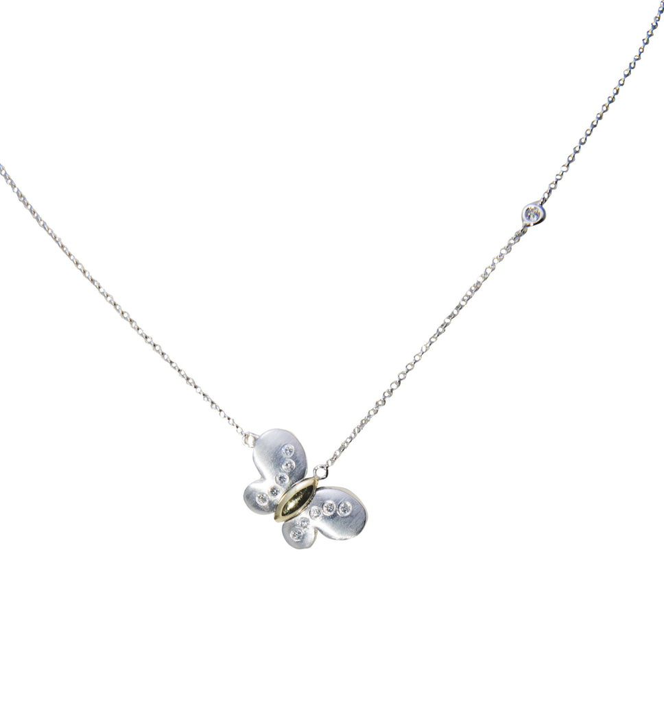  Matte finish, white and yellow gold butterfly with diamonds on a white gold chain. 11 diamonds 0.13 cts, 14kt white gold