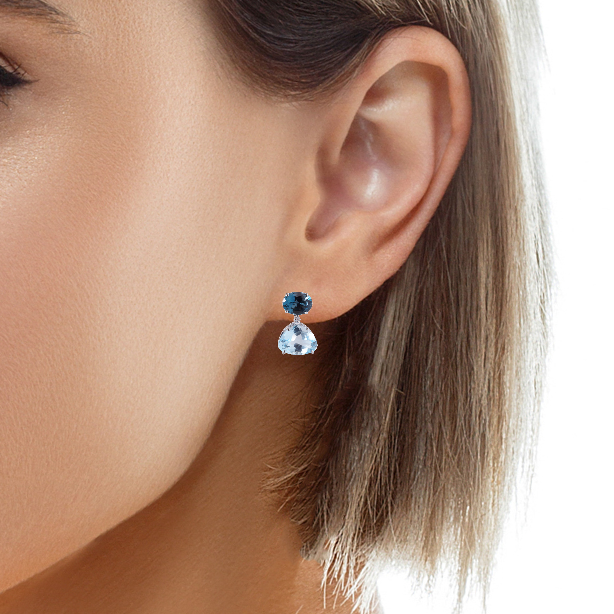 Our Vianna Brasil collection features London Blue Topaz (12.0 cts) and round Diamond (0.11 cts) Drop Earrings in 18K White Gold, measuring 19.88 mm long x 12.00 mm wide with secure friction backing.