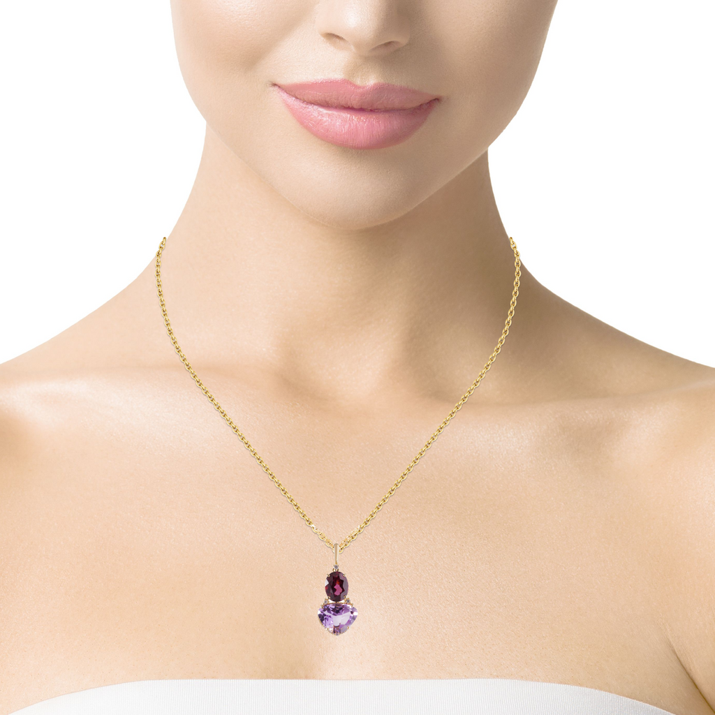 From our Vianna Brasil collection, this stunning pendant features a combination of amethyst, rhodolite and .07 cts diamonds set into 18 karat yellow gold for a timeless look. A 14k yellow gold 18" necklace is optional for $320.00. 27.00 mm x 16.00 mm.