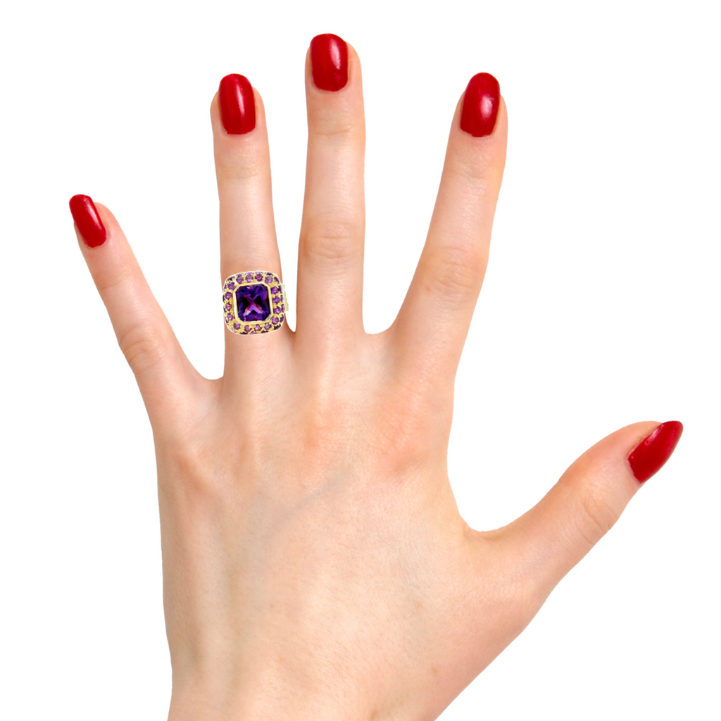 A beautiful and regally cut Italian emerald-cut amethyst is set in an ornate 18K gold shank (18.00 mm) and surrounded by amethyst pavé, giving it an eye-catching sparkle. With a size that's customizable, this ring will be an elegant and unforgettable addition to your jewelry collection. Size 7.
