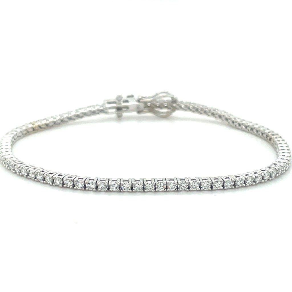 Ladies Line bracelet   2.07 cts round cut diamonds   Color F-G  Clarity SI-1-2 All prong set  7" length  14kt white