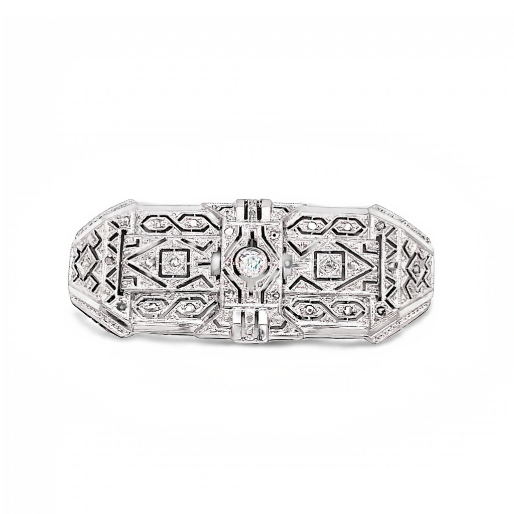 This gorgeous antique brooch is expertly crafted with solid 14k white gold, round diamonds, and a filigree style. It measures 35.00 x 17.00 mm and is in great condition, perfect for wearing as a brooch or pin.